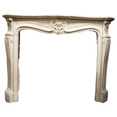 Fireplace mantle in white Carrara marble, carved with a central shell, France