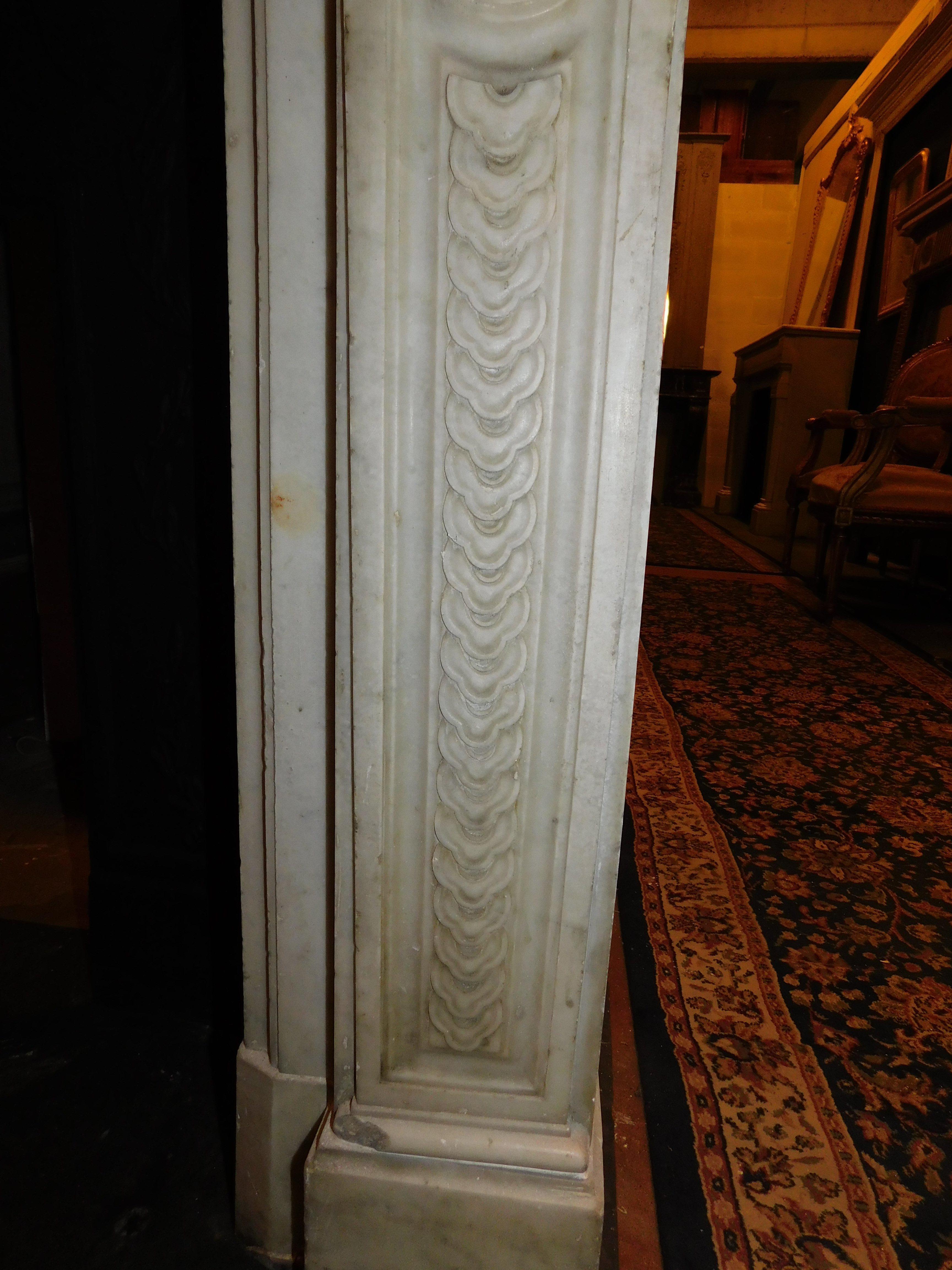 Carrara Marble Fireplace mantle in white Carrara marble with carved flowers, France For Sale
