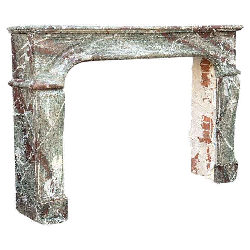 Large campan grand mélange marble fireplace. Fireplace dimensions: 95 x 128cm.