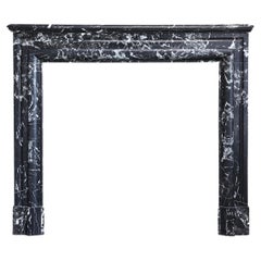 Fireplace of black Marquina marble in style of Louis XVI from the 19th century