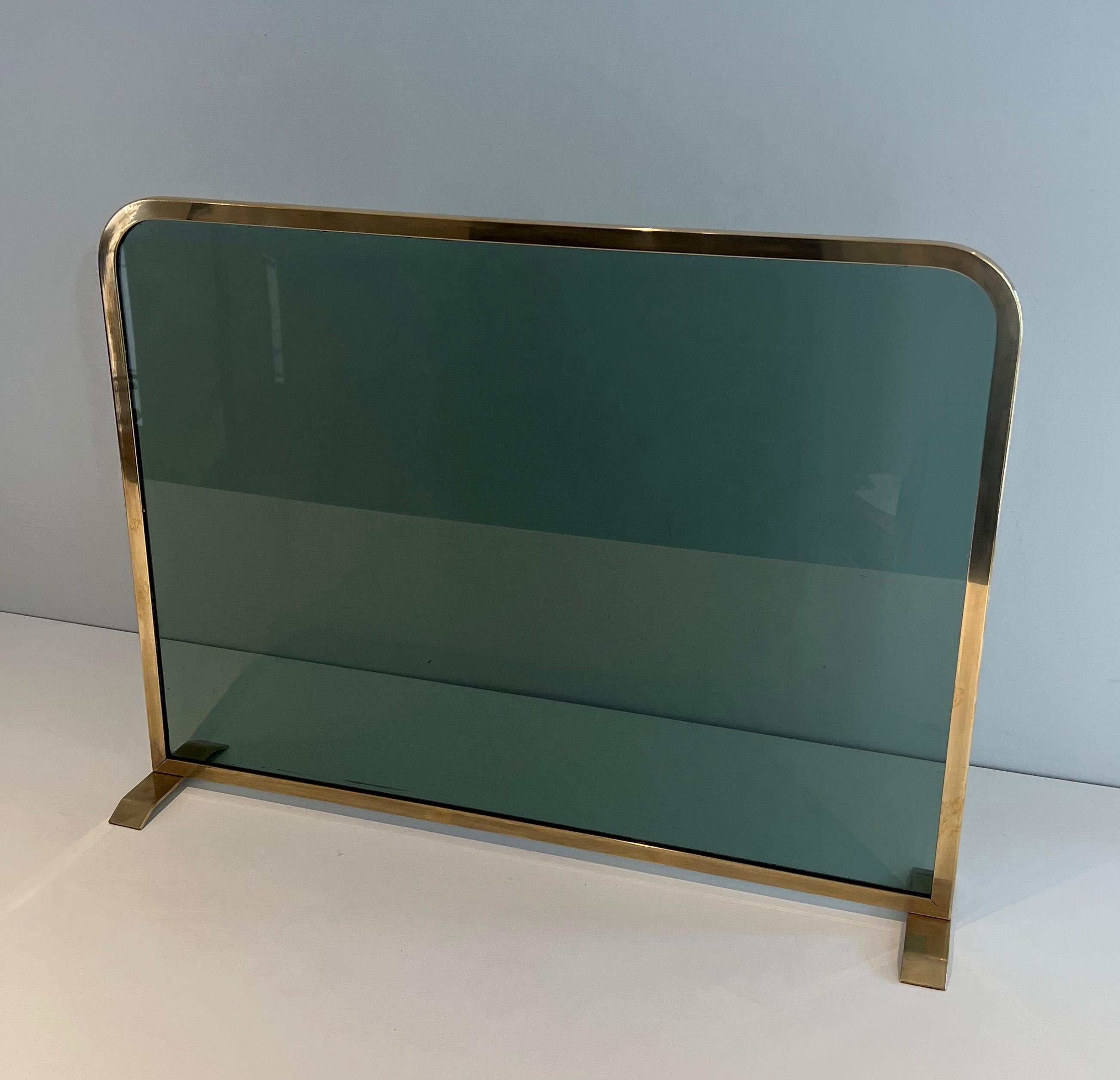 Fireplace Screen Made of a Greenish Glass Panel Surrounded by a Brass Frame For Sale 7