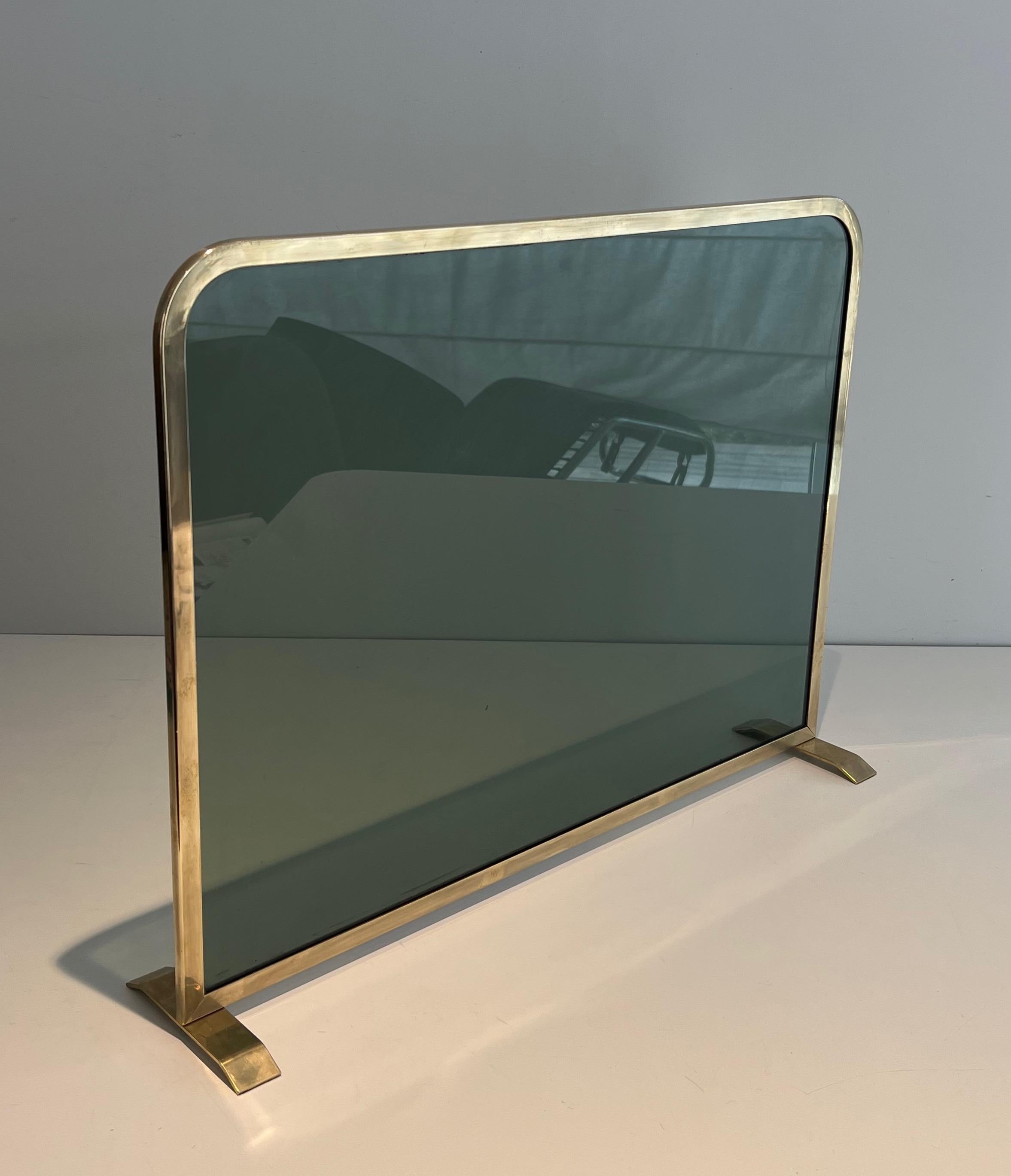 French Fireplace Screen Made of a Greenish Glass Panel Surrounded by a Brass Frame For Sale