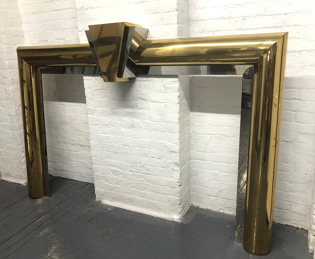 Fireplace surround in brass and steel style of Danny Alessandro.
The opening measures: 57.25 W x 38.5 H.