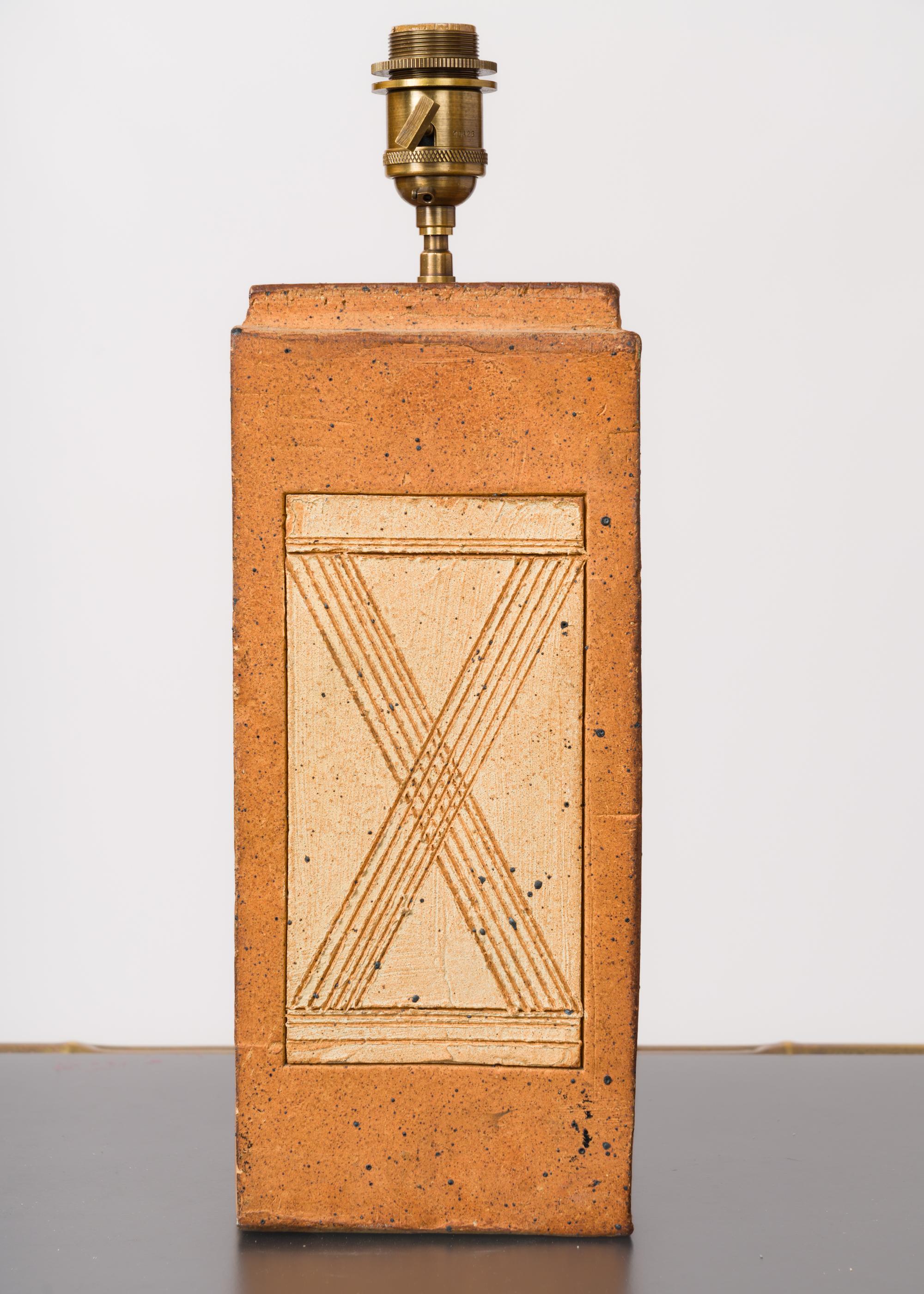 Firesand lamp, with scarified decoration on the front face and stepped top. Attributed to La Borne.
In good vintage condition.
This lamp has been rewired for use in the US.
It will ship from France and can be returned to either France or to an
