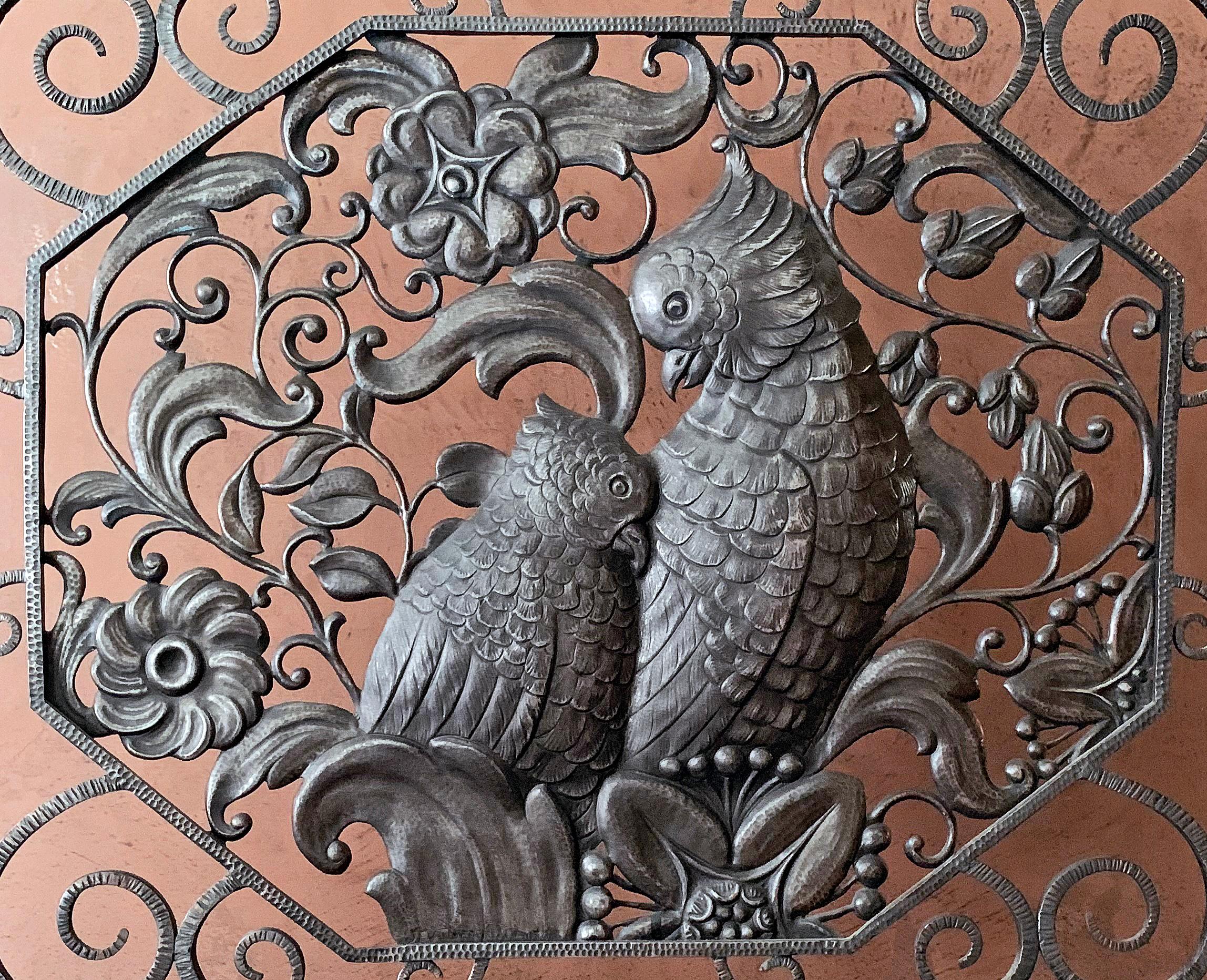 Truly remarkable, this high style Art Deco fire screen, featuring a pair of cockatoos surrounded by a dense pattern of foliate and floral motifs, framed by Art Deco tendrils and curves is an extraordinary piece of wrought iron artisanry. The artist