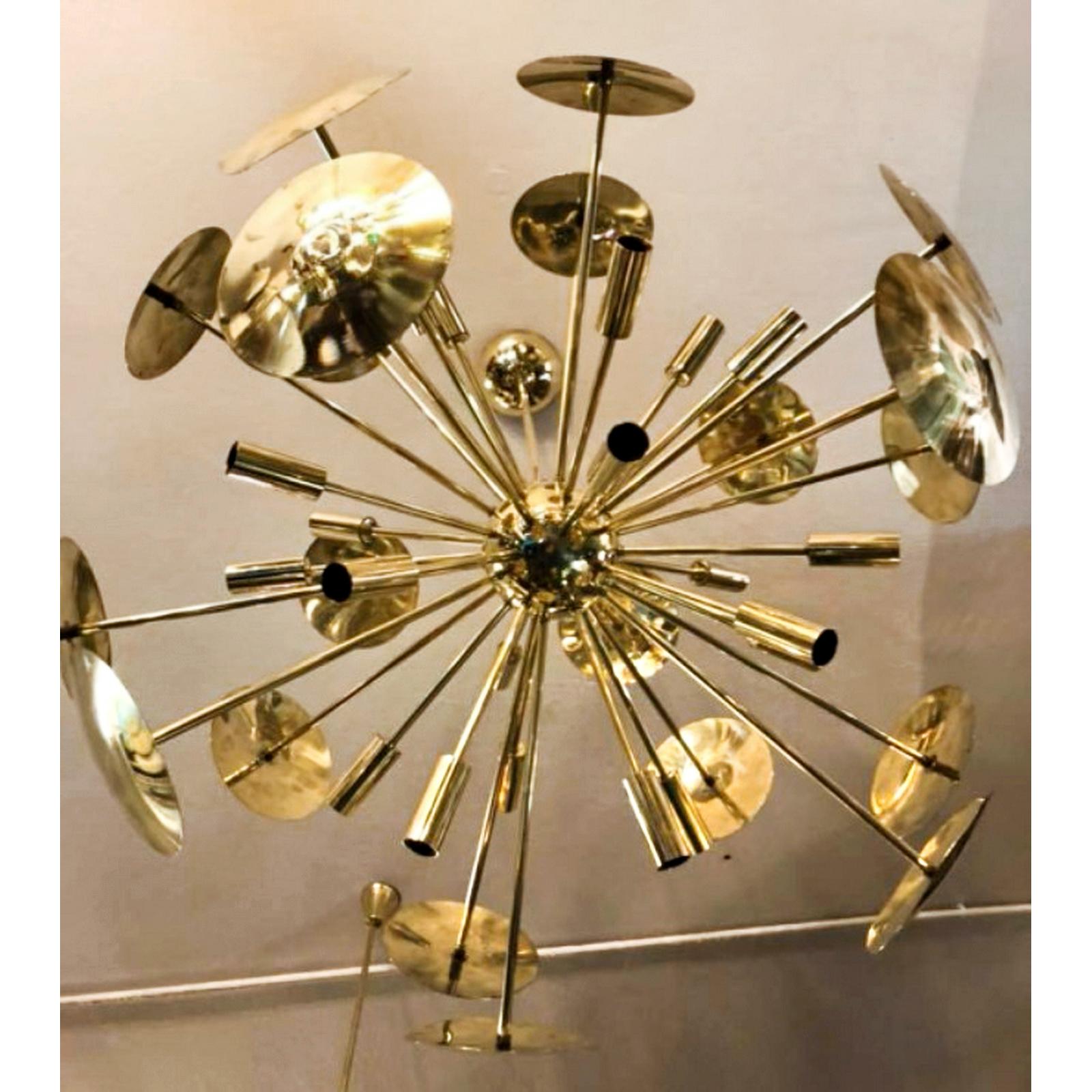Fireworks Brass Italian Chandelier Sputnik 16 Lights, 32 arms
Mid-century style Sputnik brass disc chandelier.

A gorgeous fully made brass Italian Sputnik chandelier, with 16 lights. It makes a warm and cozy light due to the light reflection in the