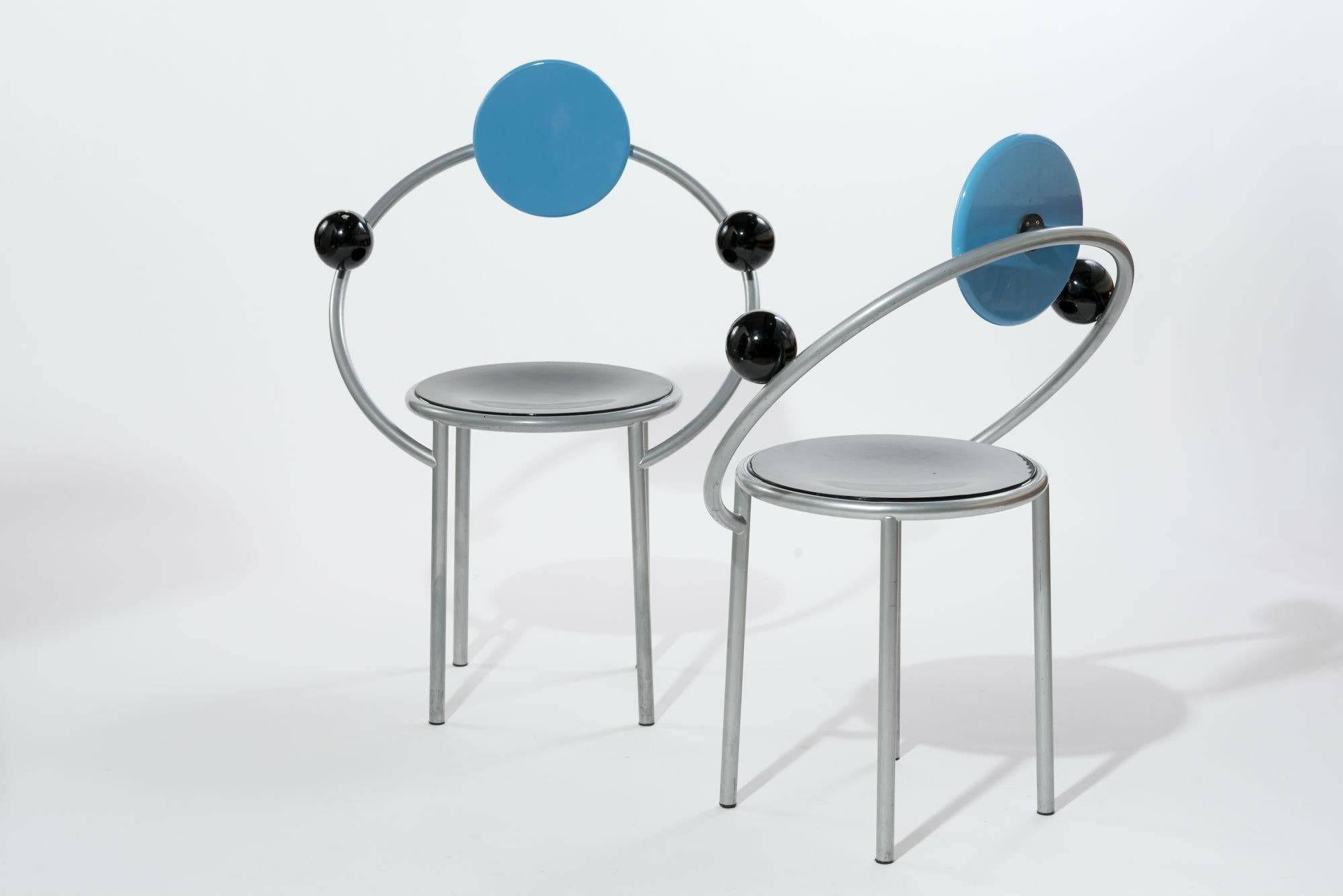 Pair of 'First' chairs, designed in the early 1980s by Michele De Lucchi, one of the founders of Memphis Milano and was in fact the first chair that was produced by the now legendary design collective. This post modern design features a round atomic