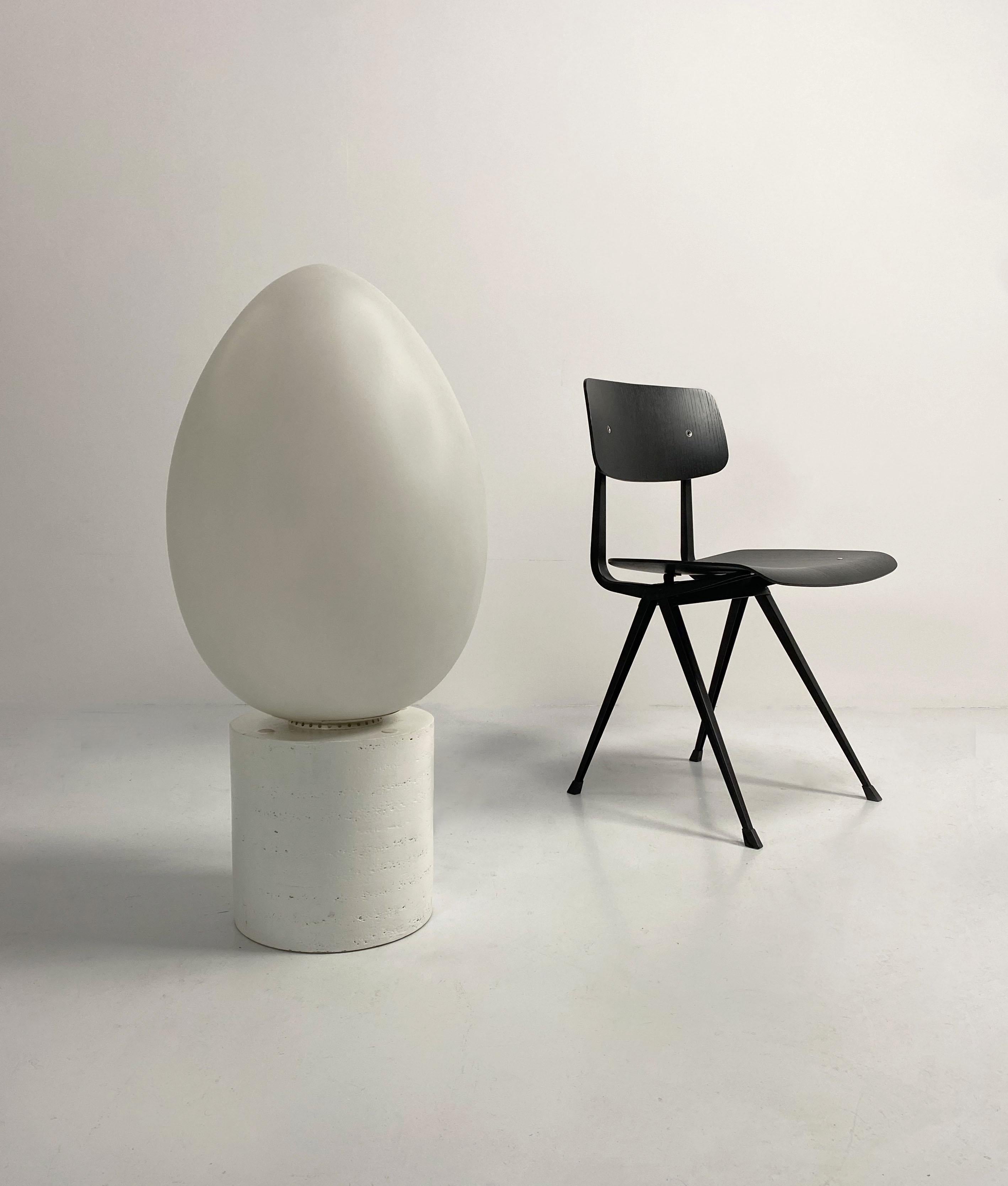 First edition Uovo lamp designed by Ben Swildens and produced by Fontana Arte in the 1970's. This is the largest model at 62 cm high. Composed of a satin opaline glass egg on a white aluminium base.
