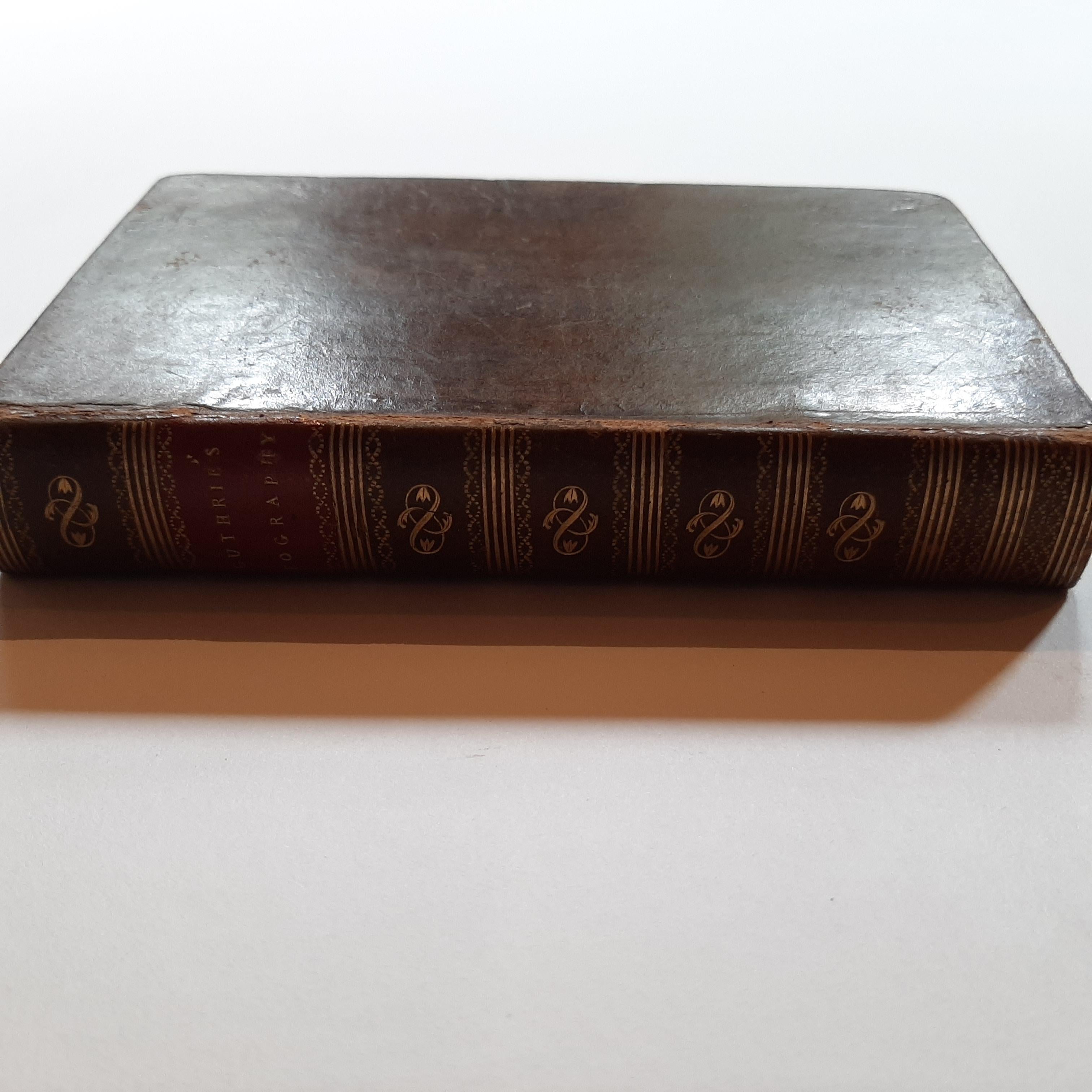 First edition of 'Guthrie's Geographical Grammar in Miniature'. 358 p. 13 fold. engr. maps, contemp. calf. Gilt spine. sm. 8vo. Upper hinge showing but strong; old bookplate 
