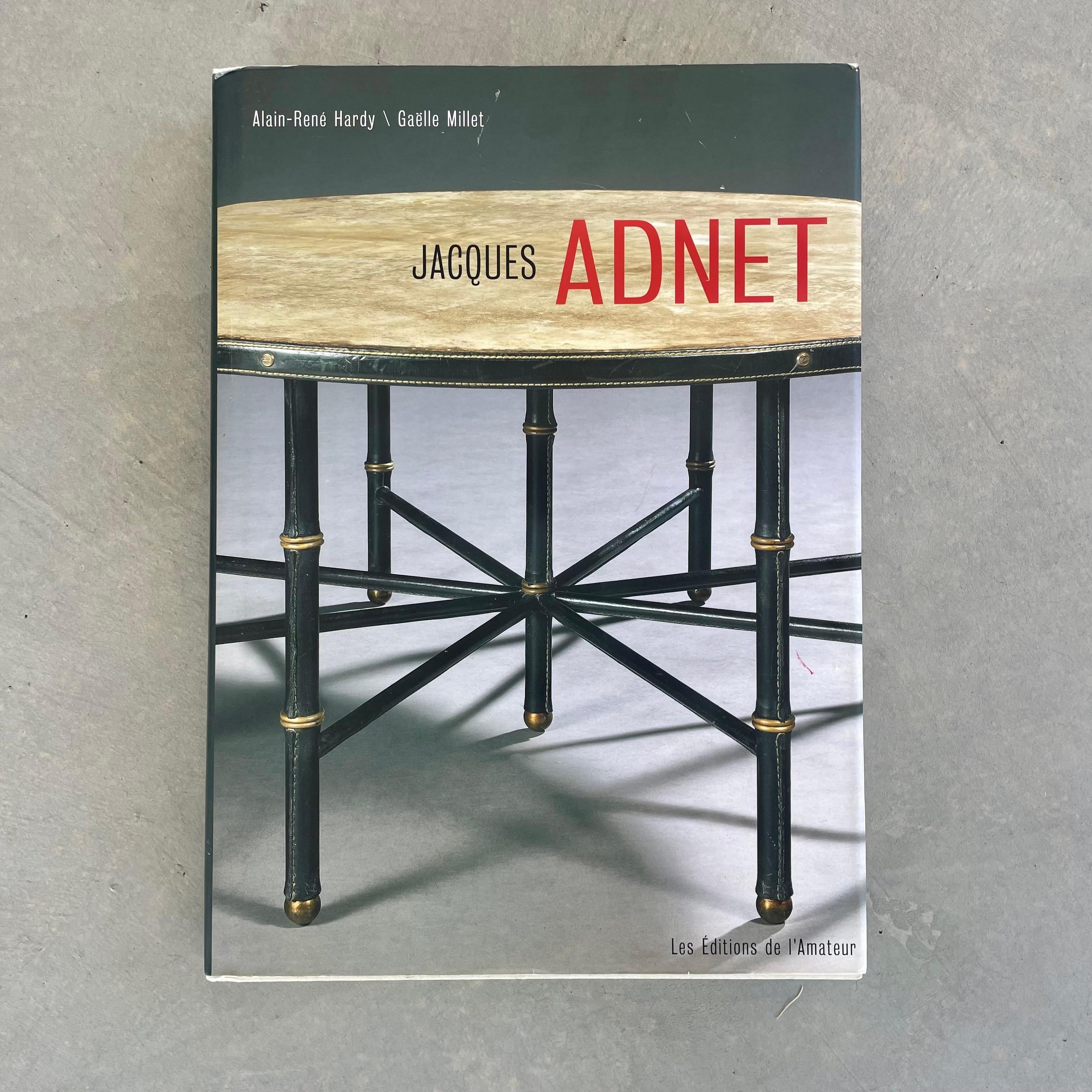 First Edition Jacques Adnet Book by Gaelle Millet & Alain-Rene Hardy. 260 Page book on the life and legacy of one of the most prolific French designers of the 20th century, Jacques Adnet. Written in French but contains universally understood beauty