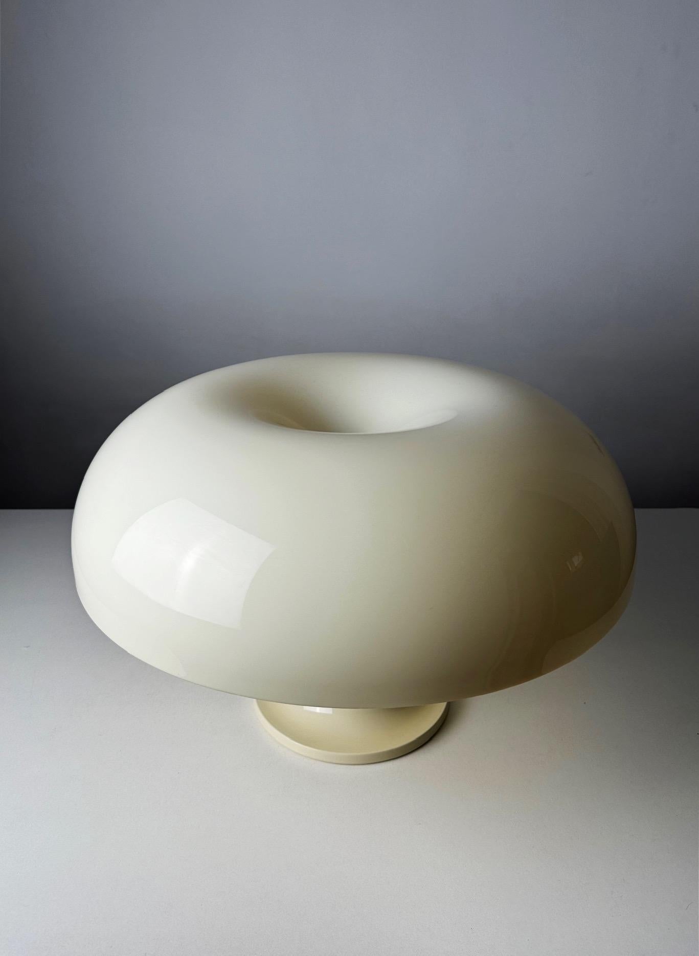 Discover the Nesso Lamp, a groundbreaking piece of 1960s design history, created by Giancarlo Mattioli for Artemide Italy. This first edition Nesso lamp represents the epitome of the Space Age movement, featuring its iconic mushroom shape and