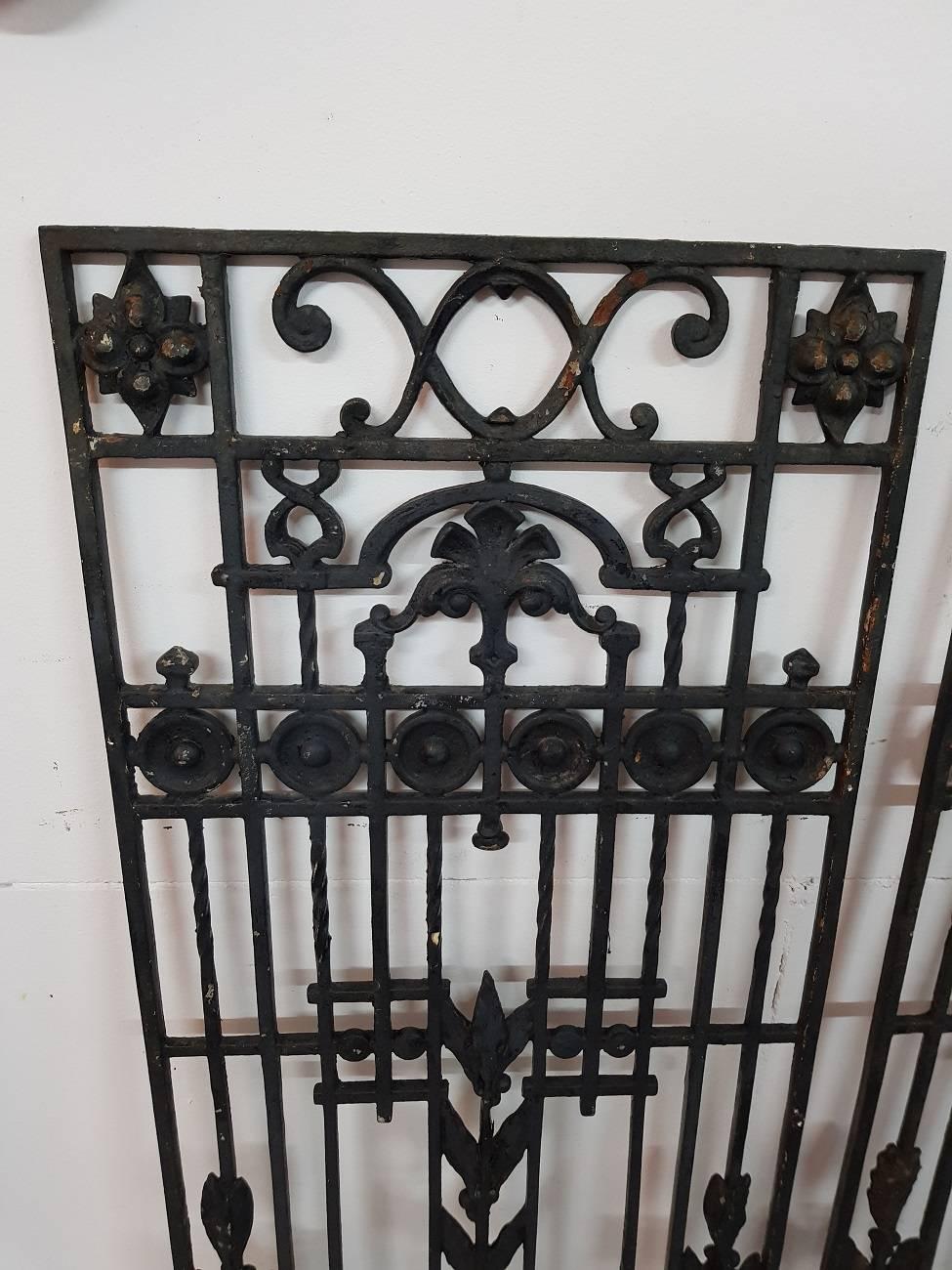 Set of two identical French cast iron door grills or fences from the first half of the 20th century.

The measurements are:
Depth 1.5 cm/ 0.6 inch.
Width 45 cm/ 17.7 inch.
Height 95 cm/ 37.4 inch.
 