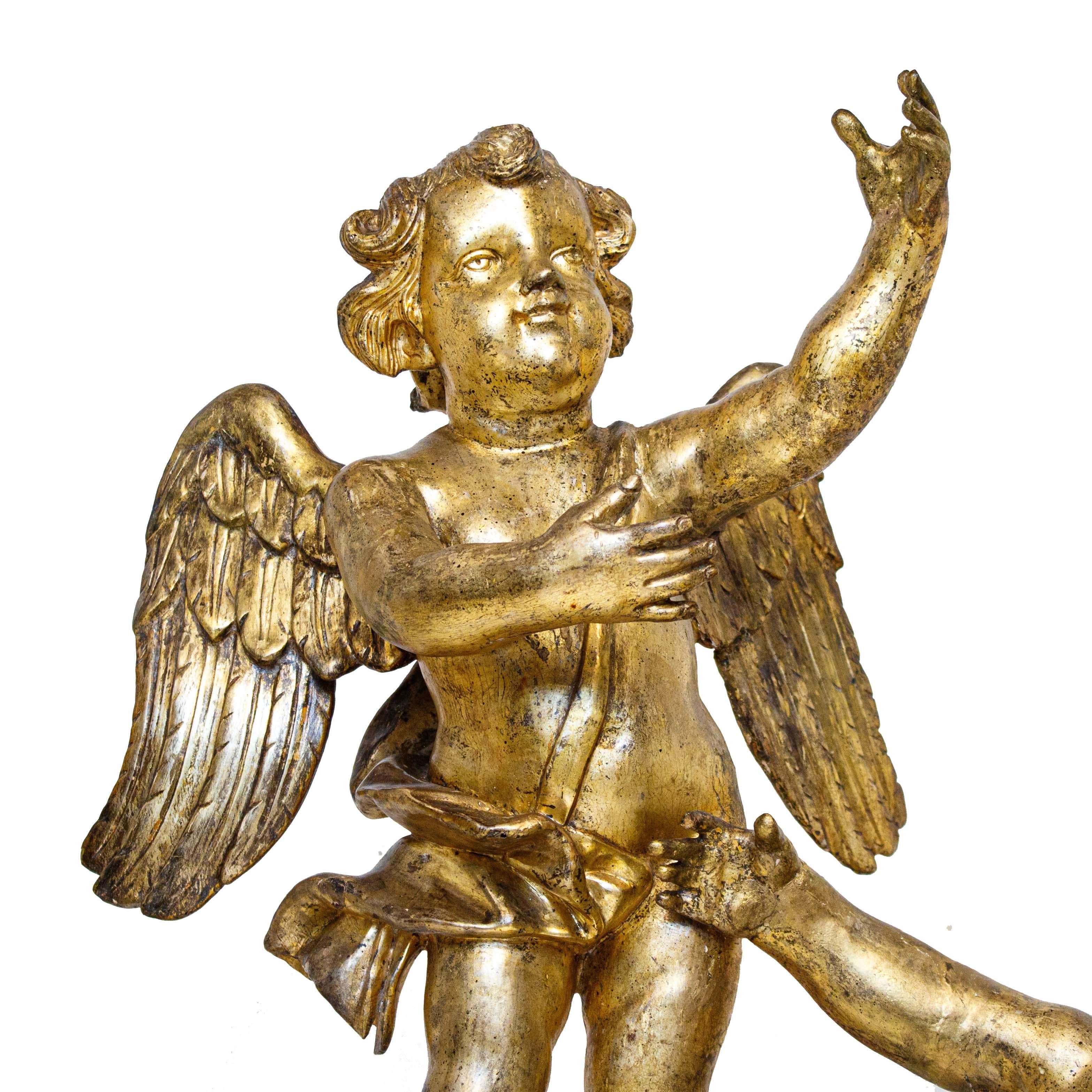 Carved First Half of the 18th Century Putti Pair of Sculptures in Gilded Wood For Sale