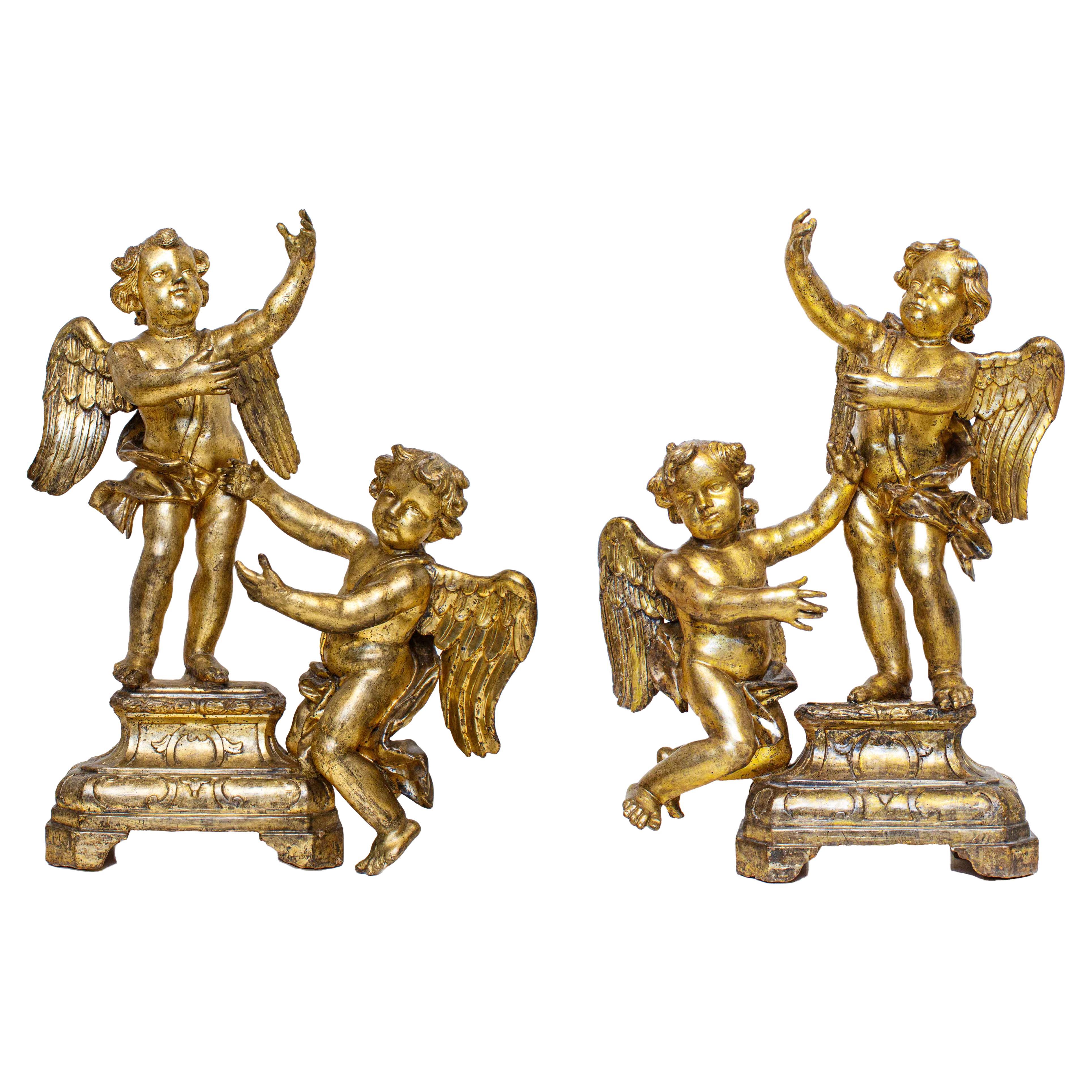 First Half of the 18th Century Putti Pair of Sculptures in Gilded Wood For Sale