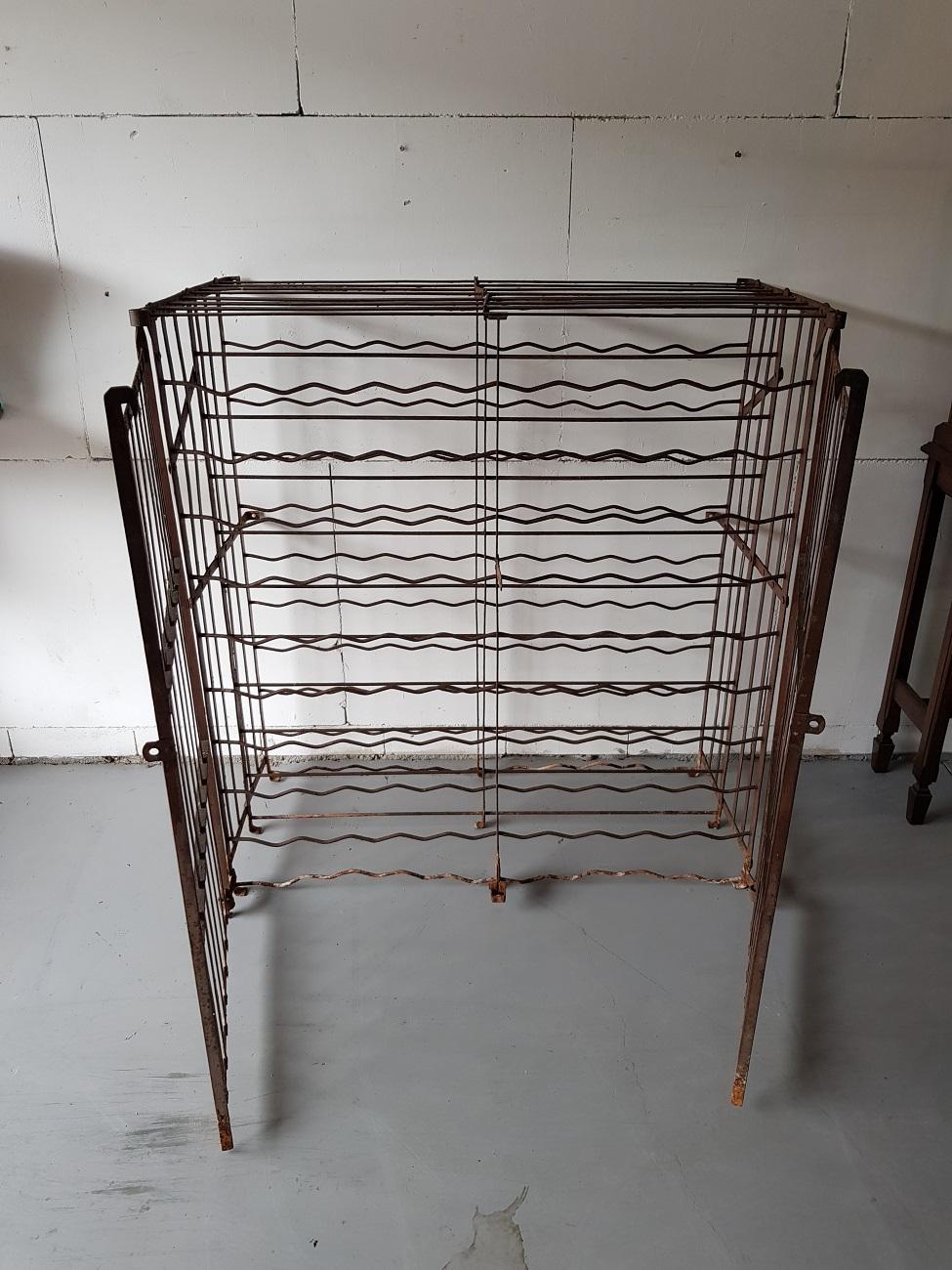 Early 20th century French brown colored metal wine rack to store a total of 200 bottles and can be put with a padlock locked, First half of 20th century.

The measurements are:
Depth 58 cm/ 22.8 inch.
Width 105 cm/ 41.3 inch.
Height 113 cm/