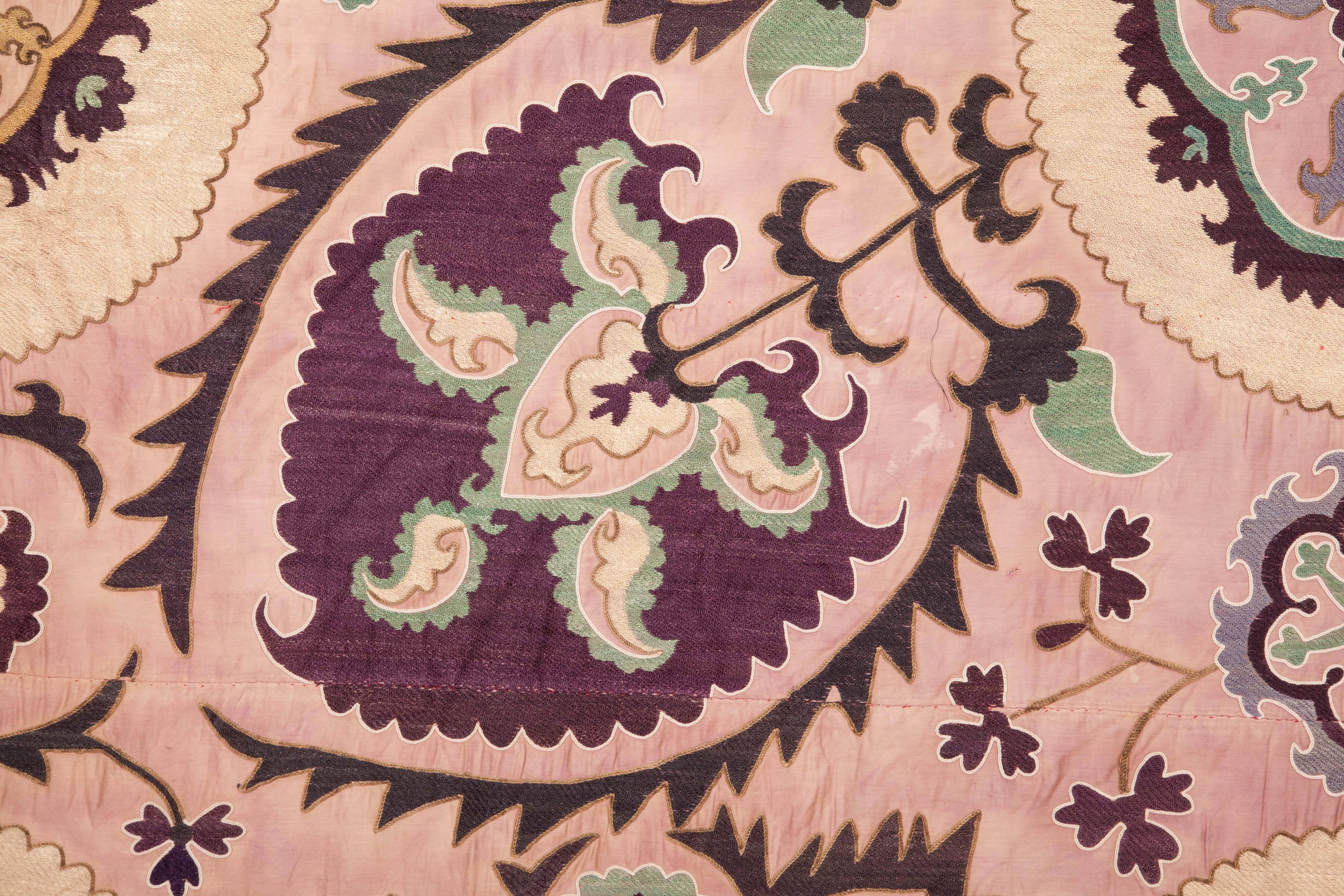 Finely embroidered Suzani is lined with Russian cotton print.