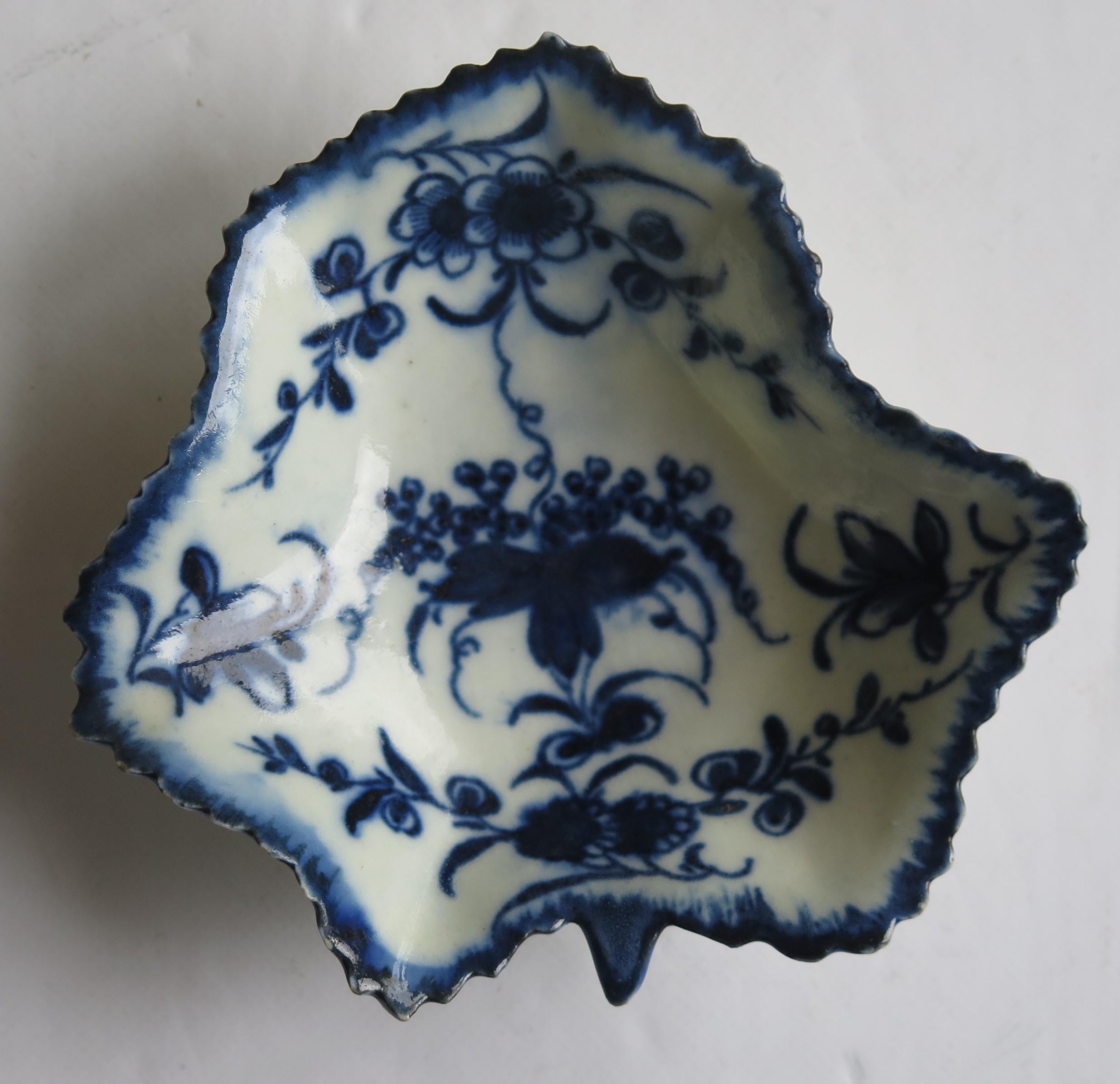 This is a very good early, First period (Dr. Wall), Worcester porcelain leaf shaped Pickle Dish in a deep cobalt blue floral pattern with a Crescent mark to the base. dating to 1770 to 1775.

This is a well potted moulded piece showing the leaf