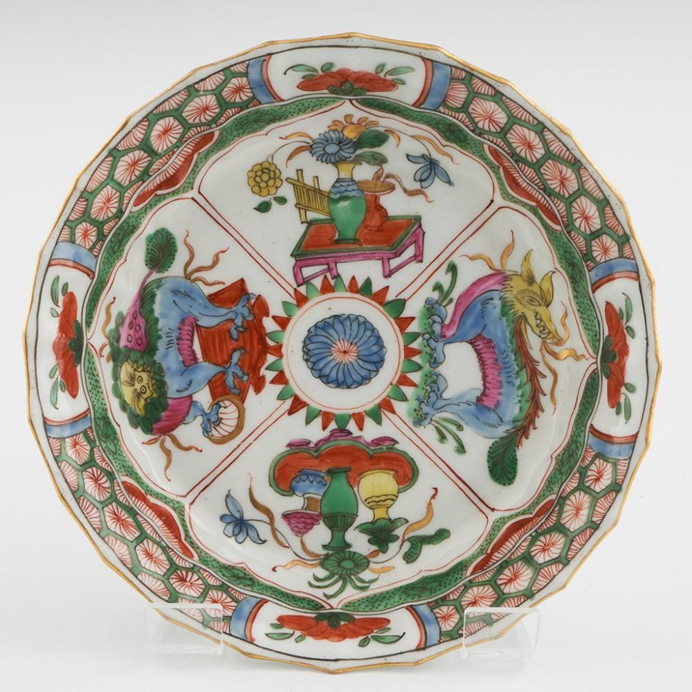 Heading : Fluted Worcester porcelain trio
Date : 1765-80
Period : George III
Marks : Square seal mark to all
Origin : Worcester, England
Colour : Polychrome
Pattern : Dragons in compartments pattern
Features : 16 sided fluted shaped trio with