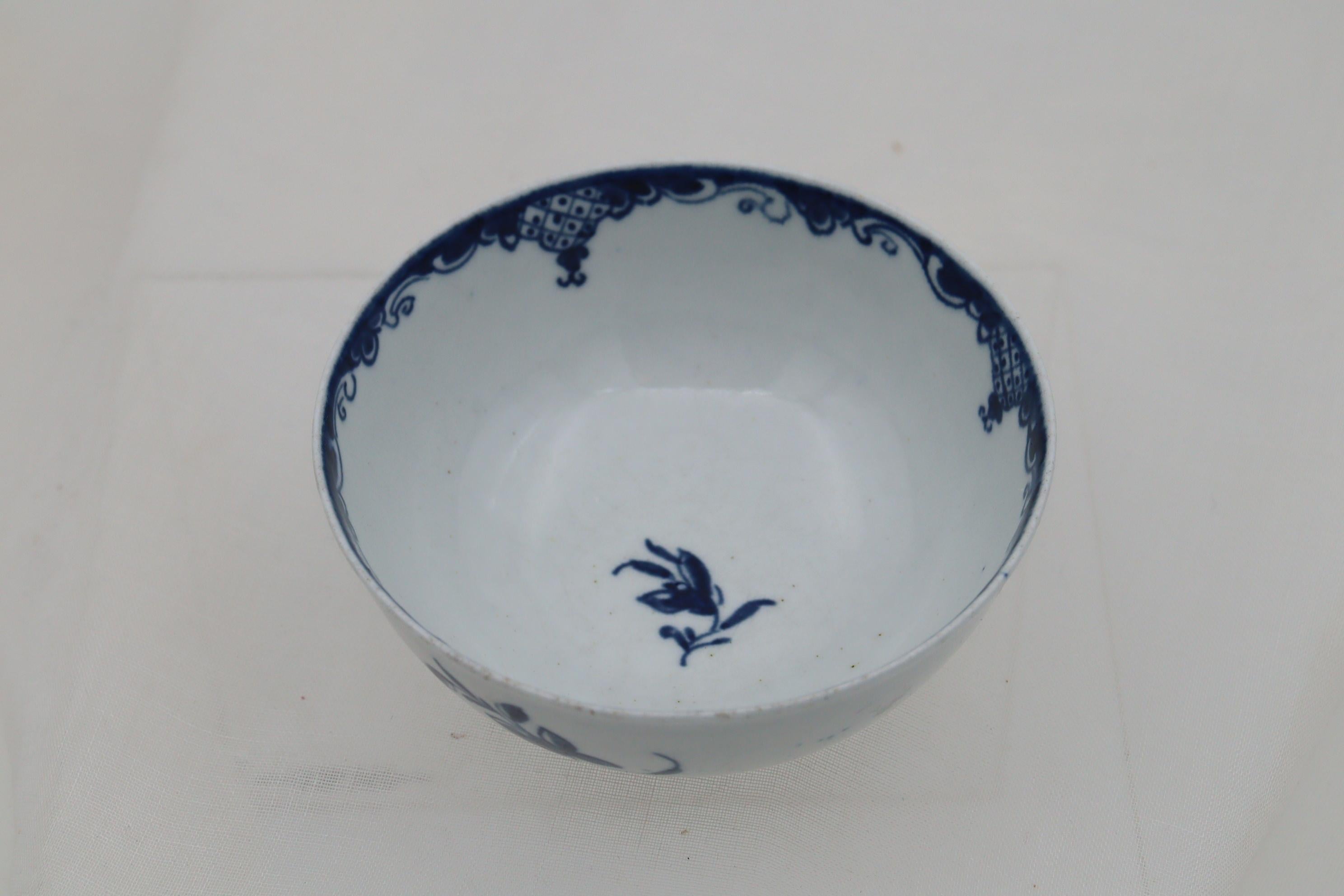 This first period Worcester bowl is decorated with the hand painted blue and white 