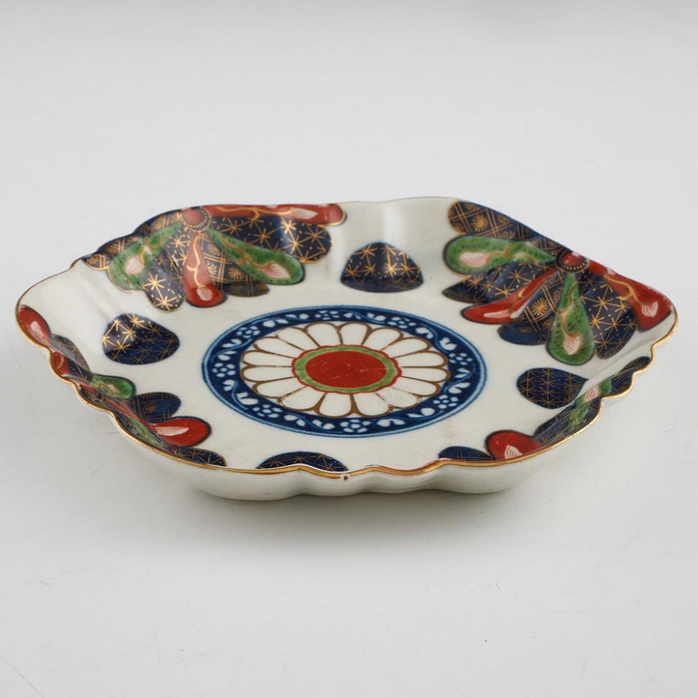 Heading :  First period Worcester porcelain Japan Fan pattern teapot stand
Date : c1770
Period : George III
Marks : Pseudo Chinese script
Origin : Worcester, England
Colour : Polychrome - Imari palette
Pattern : Fan
Condition : Excellent, no chips