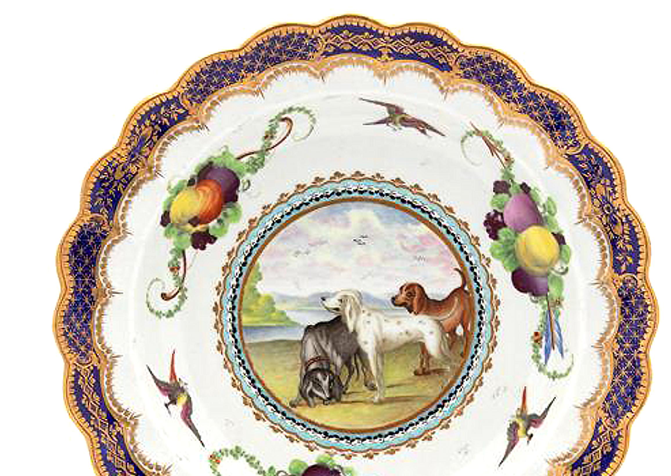 First period Worcester porcelain fable plate,
Lord Henry Thynne Pattern,
Painting in Jefferyes Hamett O'Neale style,
circa 1775.

The First Period Worcester porcelain scalloped plate is painted with a central circular reserved panel with hounds