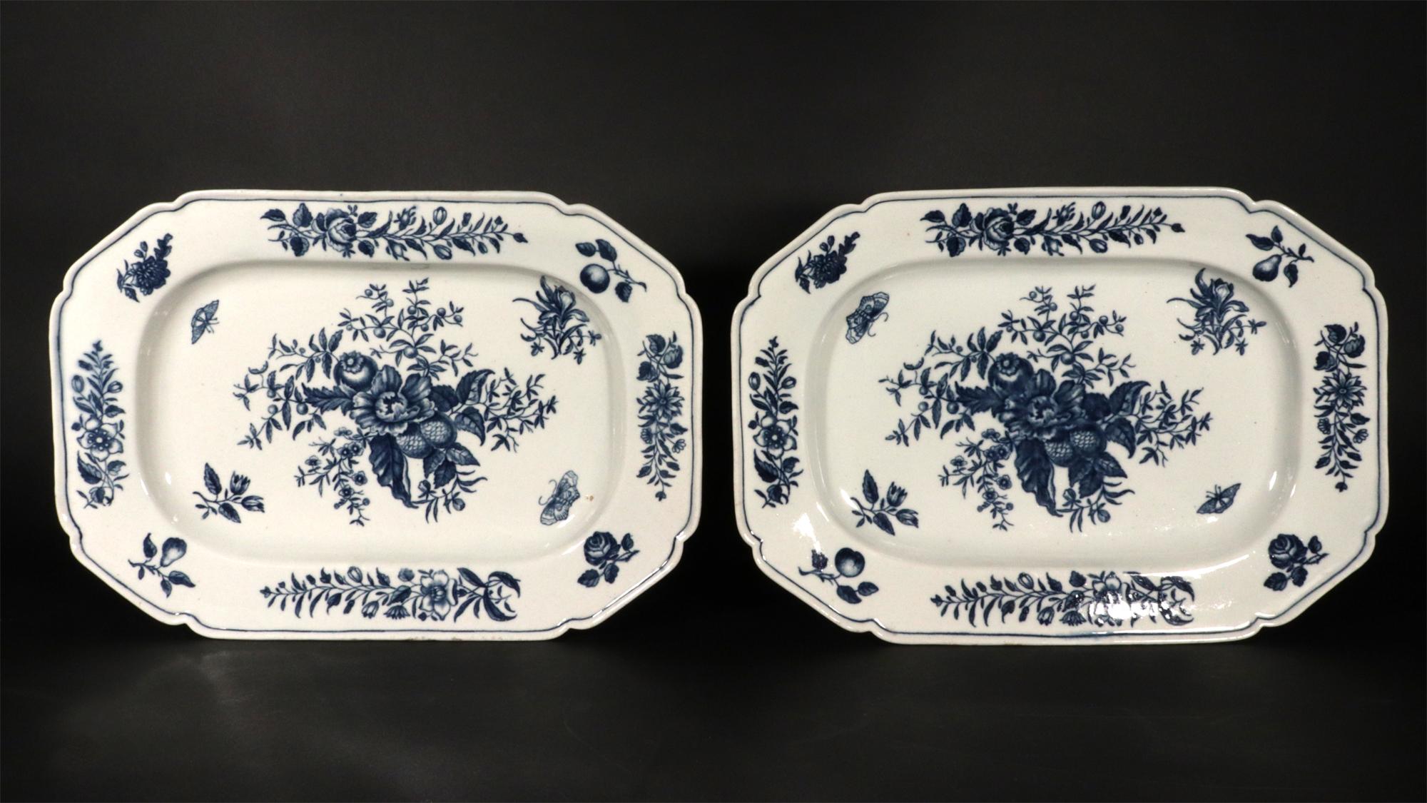 First Period Worcester Porcelain Pine Cone Pattern Dishes,
A Pair,
Circa 1770

These rectangular dishes are a quintessential example of First Period Worcester porcelain, dating from the Dr. Wall era (1751-1783). Executed in a vibrant underglaze