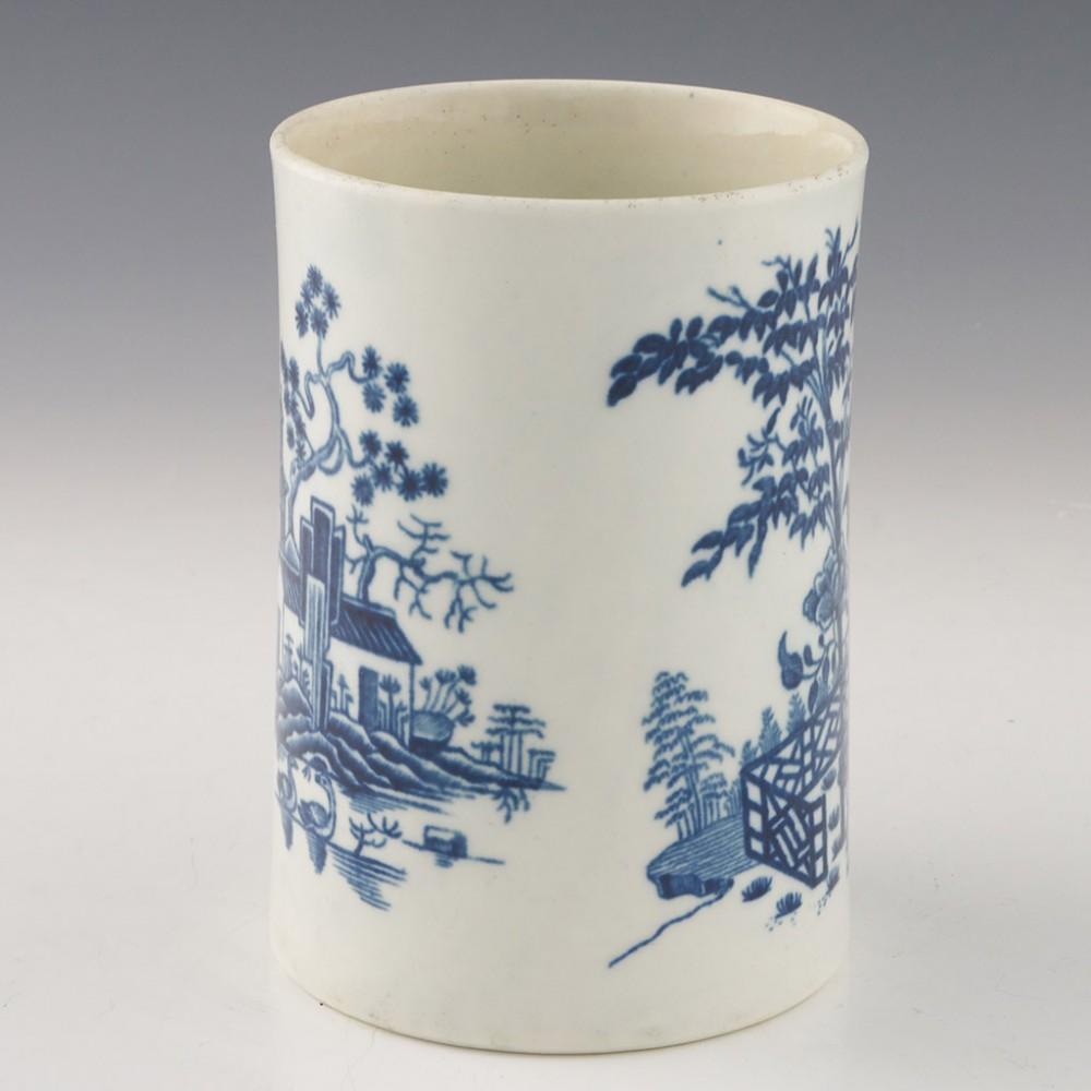 Heading :  First period Worcester porcelain The Plantation pattern mug
Date : 1760-1770
Period : George III
Marks : Crescent
Origin : Worcester, England
Colour : Blue and White
Pattern : The Plantation
Condition : Excellent, no chips or