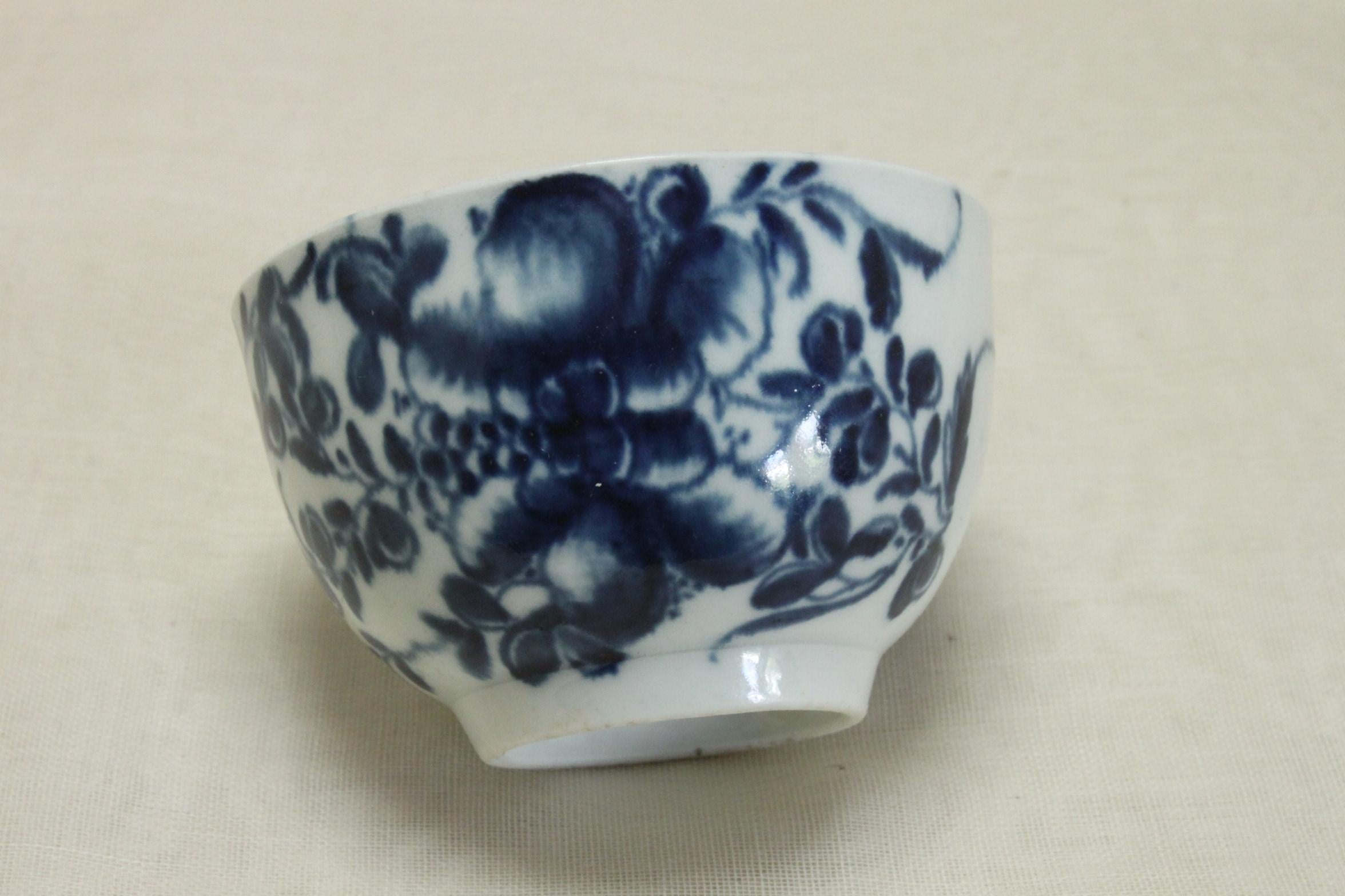 This First period Worcester porcelain tea bowl is decorated with the hand painted Mansfield pattern and a hand painted border (refer border pattern No 29, page 409 