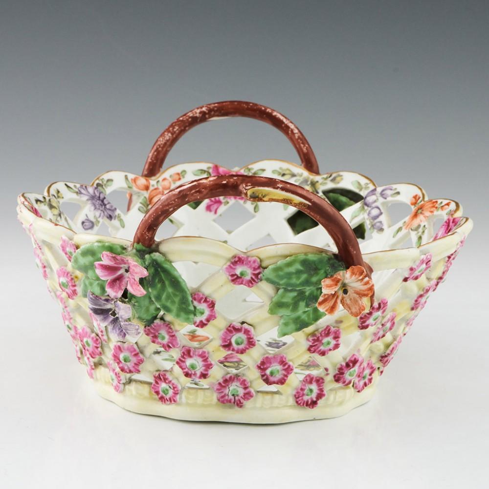First Period Worcester Yellow Ground Dessert Basket, c1770

Additional information:
Date : c1770
Period : George III
Marks : None
Origin : Worcester
Colour : Polychrome
Pattern : Applied flowers to the outside, enamelled flowers within including a