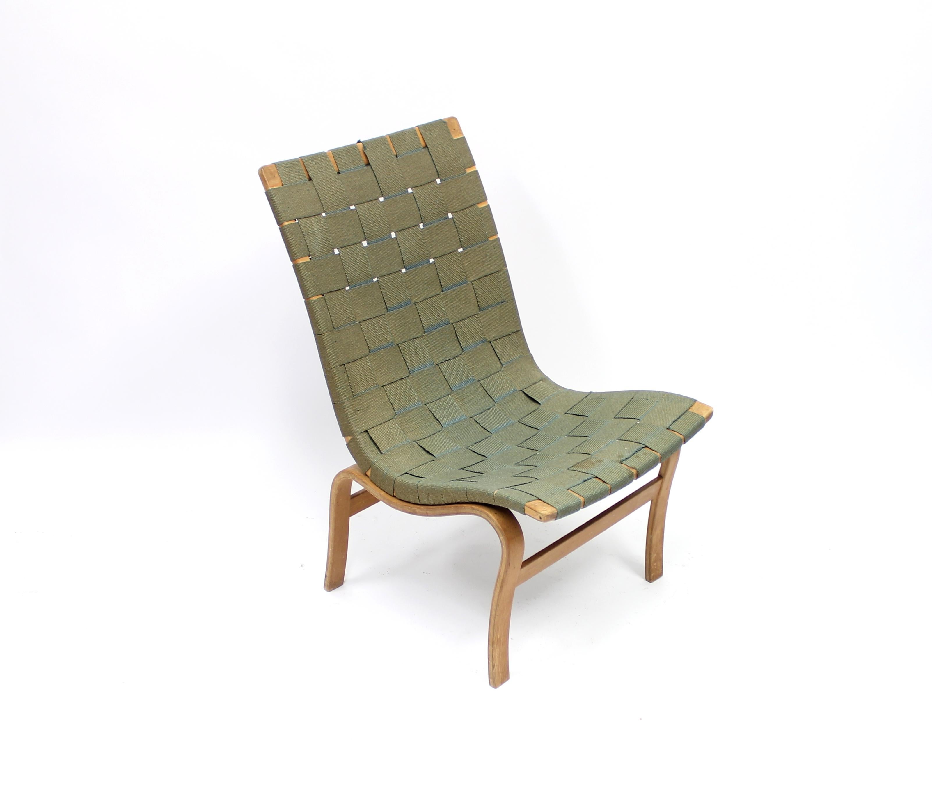 First year production model 41, Eva chair, designed by Bruno Mathsson for Karl Mathsson, 1940. Labeled, stamped and hand signed by maker. Green hemp-webbing, birch leg frame. Most likely original hemp-webbing or a later but very early example. A