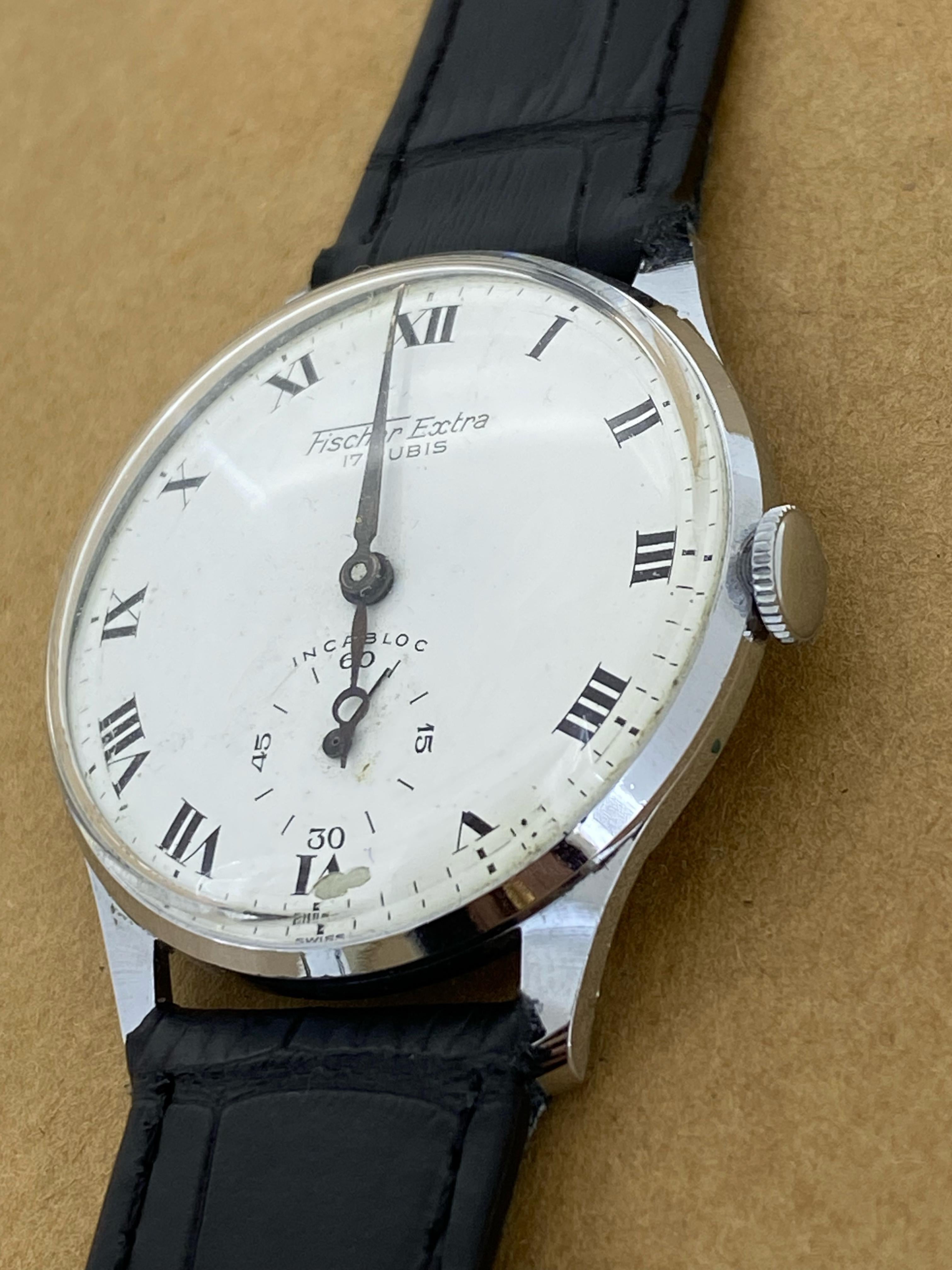 This elegant vintage wristwatch is
dating back to 1950’s & featuring: 

35mm Stainless Steel Case, 
with solid caseback

White coloured Porcelain Dial, 
adorned with hand-painted Roman numerals & 
original sword-shaped & Breguet hands, 
with