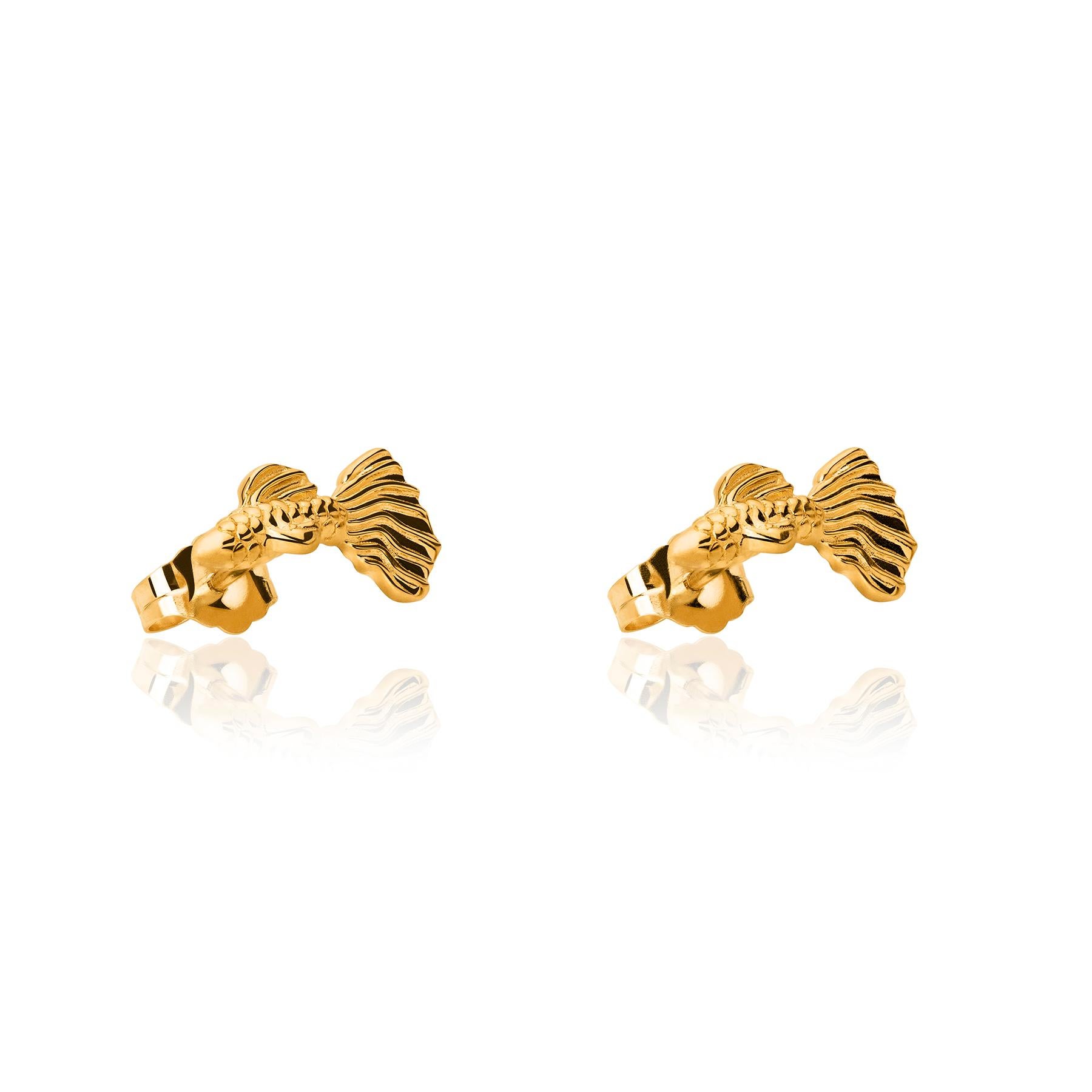 The Fish Gold Earrings from the Animales Collection by TANE are made in 18 karat yellow gold. They are made in the shape of a fish sculpted with the utmost attention to detail in its shape and textures. Handmade in Mexico.