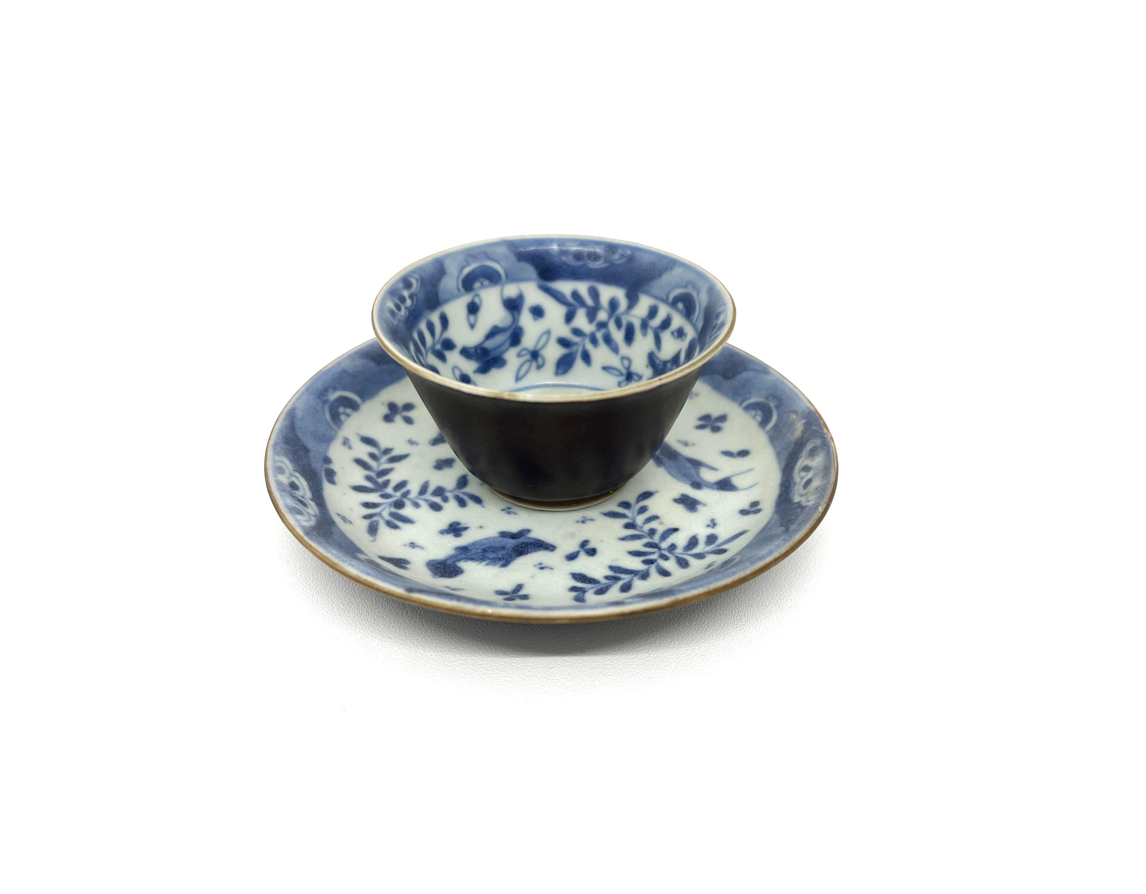 * Set Item(Teabowl and saucer)
The saucer with four carp swimming among floating dumps of water weed, the teabowl with a central carp medallion within a band of smaller fish and water weed, the rim with blue-washed floral borders, the reverse glazed