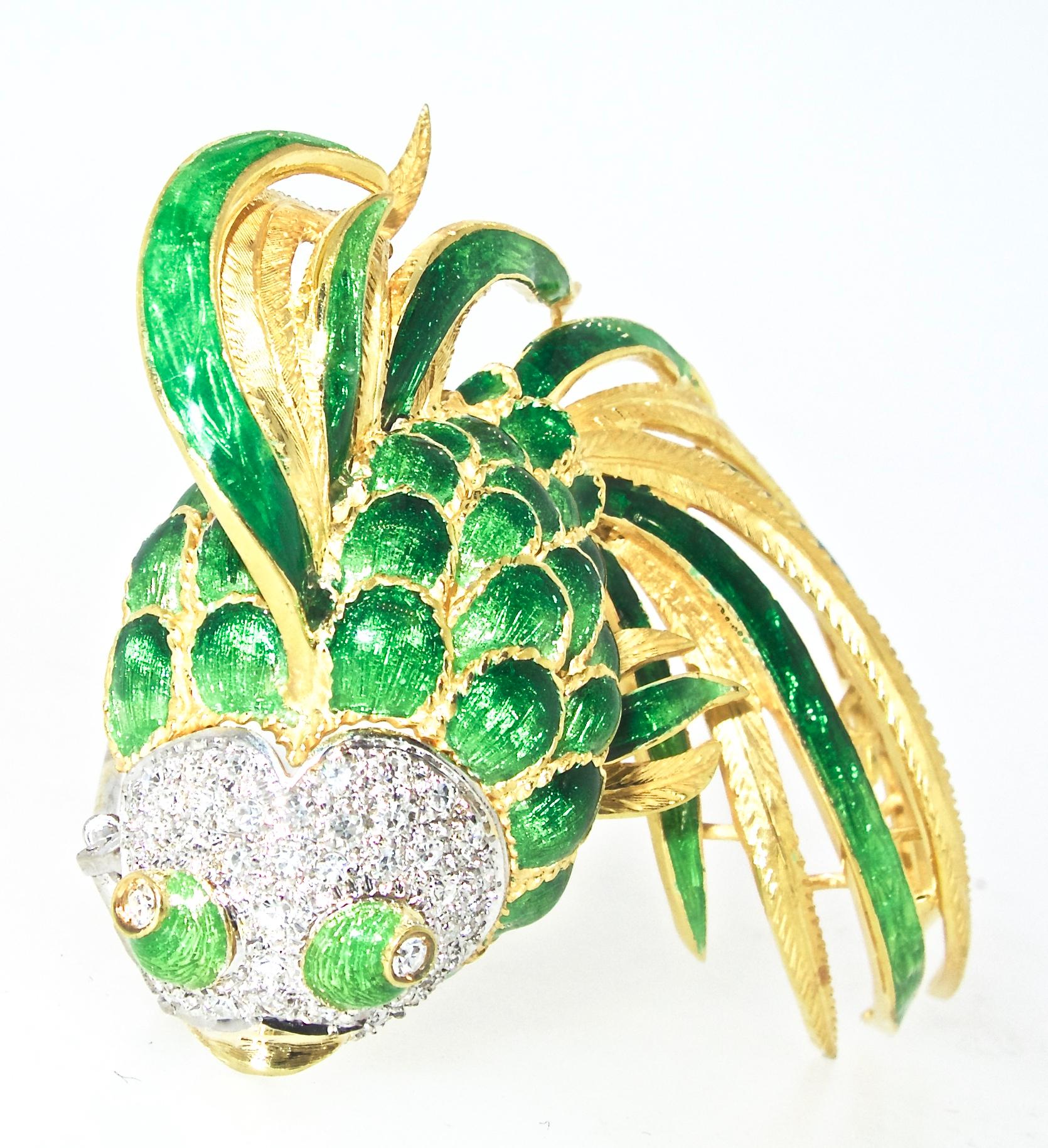 1960's brooch, 18K, large and full of personality, this fan-tail fish has a diamond studded head, diamond eyes and beautiful bright green enamel.  There are 44 fine white diamonds, all near colorless (H), and very slightly included, (VS), pave set,