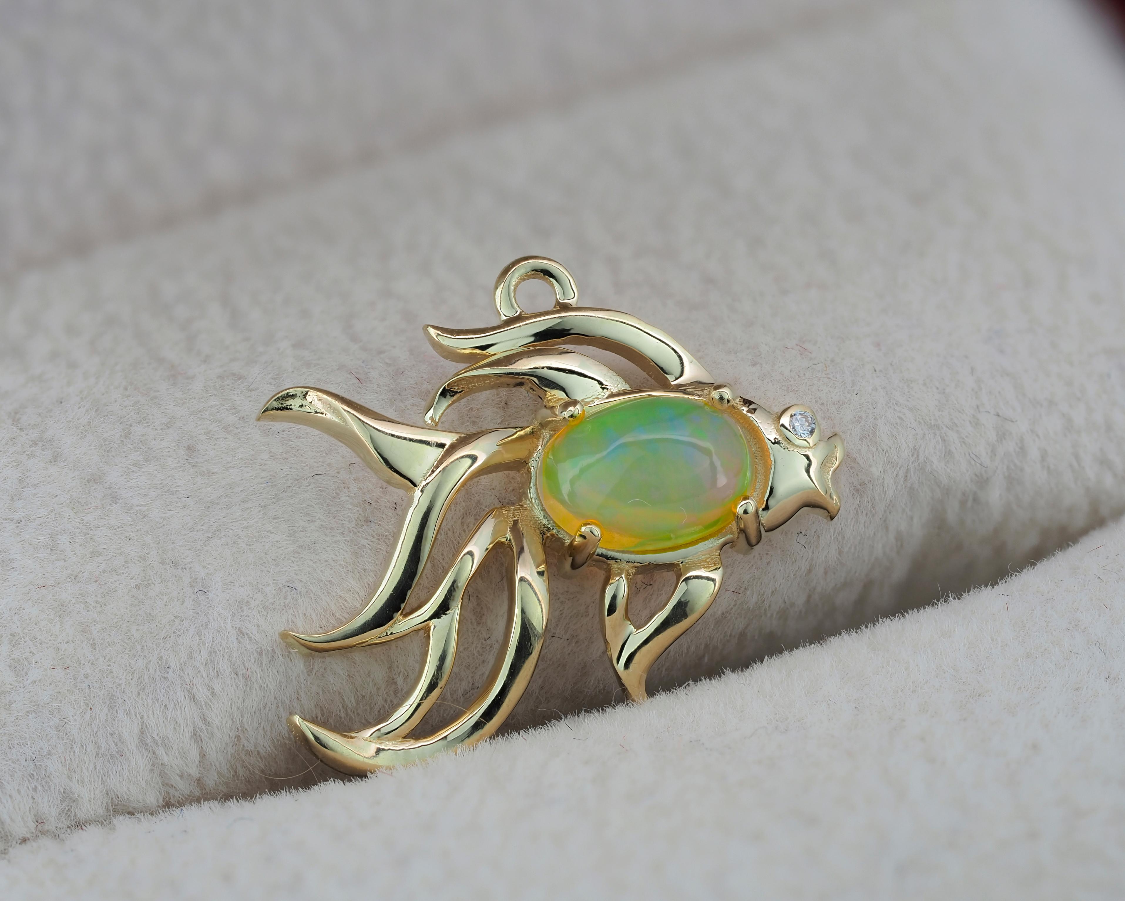 Fish design 14 kt solid gold pendant with natural opal and diamond. October birthstone.
Size: 18 x 16 mm.
Weight: 1.3 g.
Set with opal: color - multi color
Oval cabochon cut, 0.80 ct in total, 6 x 4 mm.
Clarity: Transparent
Surrounding