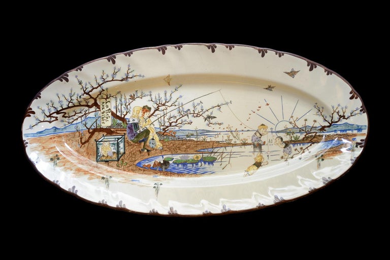 This wonderful incredibly colorful fish dish was realized by Creil & Montereau earthenware circa 1880. It is representing 