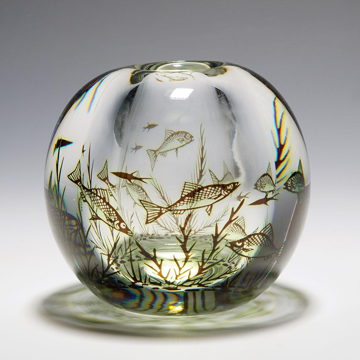 Fish Graal vase by Edward Hald for Orrefors, Sweden 1957.

A heavy vase of the Graal series designed by Edvward Hald for Orrefors Sweden in 1938. Clear and green glas decorated with underwater flora and fishes, overlayed with a thick clear glass