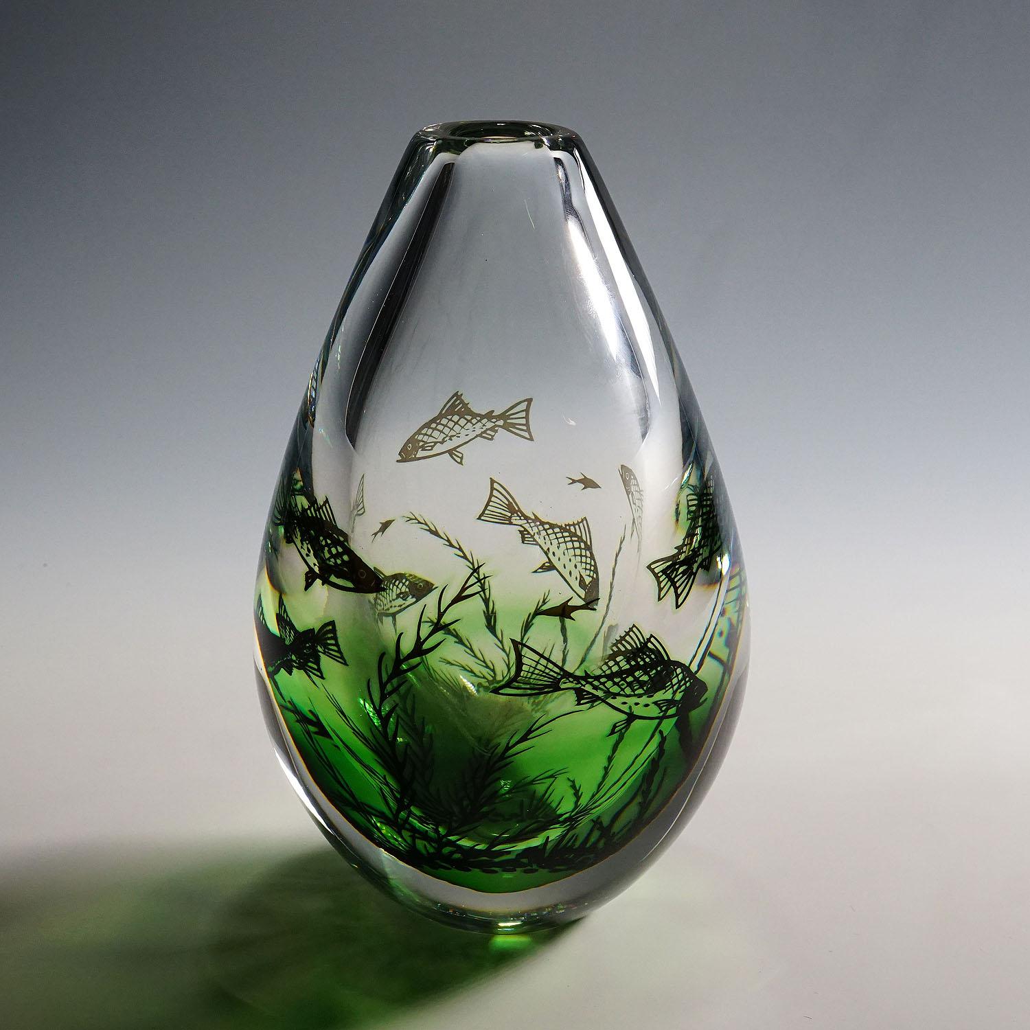 Fish Graal vase by Edward Hald for Orrefors, Sweden

A large and heavy vase of the Graal series designed by Edvward Hald for Orrefors Sweden in 1938. Clear and green glas decorated with underwater flora and fishes, overlayed with a thick clear glass