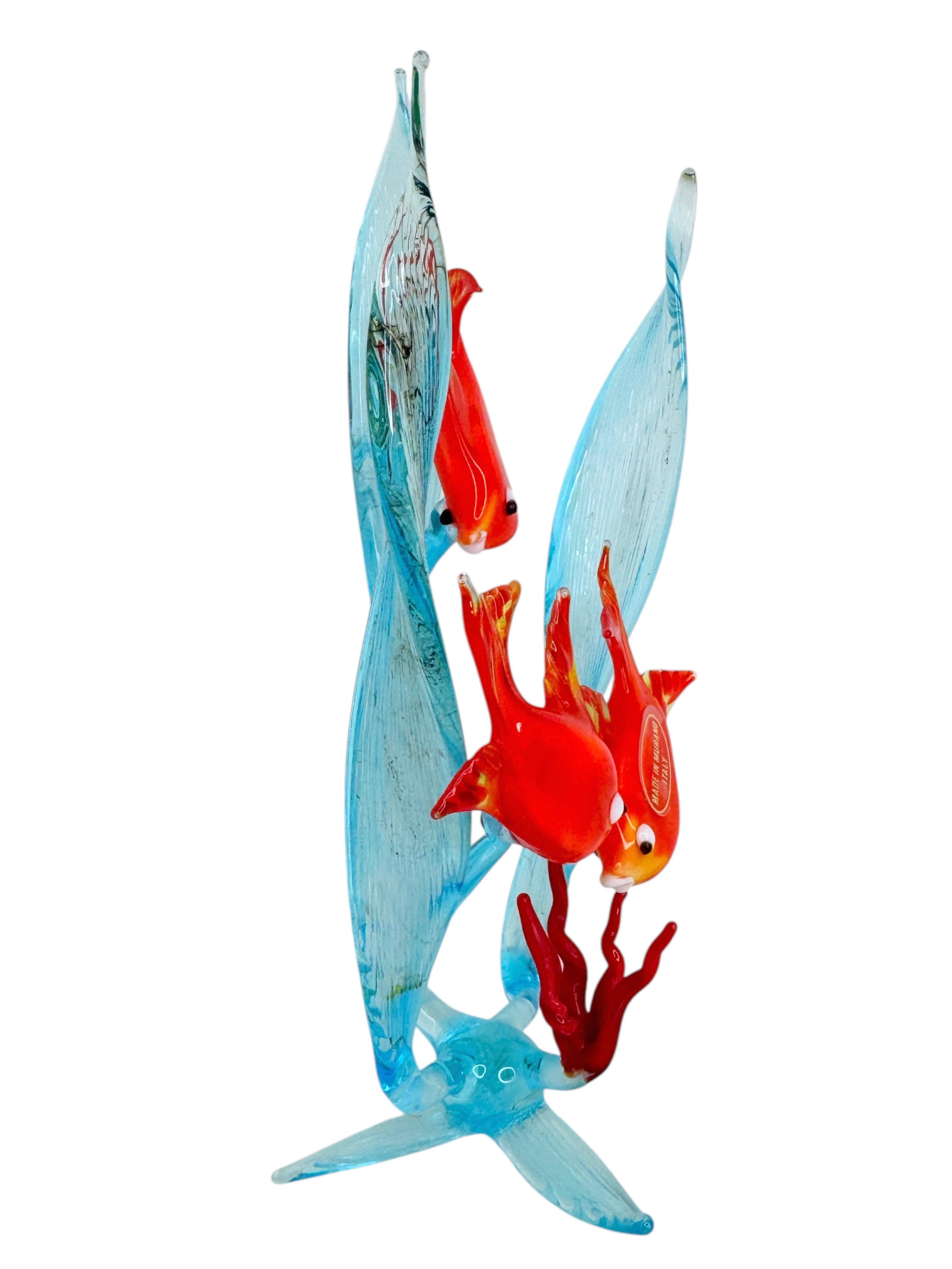Murano, Italian art glass, three fish in a coral reef, multicolored sculpture, circa 1970.
Beautiful vintage mouth-blown Murano art glass sculpture featuring colorful tropical fish on a large coral sculpture.
Colorful fish in bright yellow and