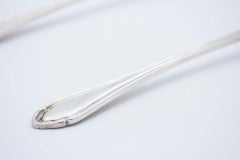 Fish knife and fork in cut and engraved silver, with friezes along the handles