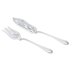 Fish knife and fork in cut and engraved silver, with friezes along the handles