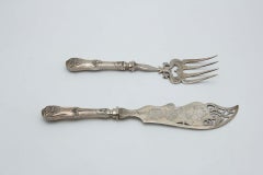 Fish knife and fork with engravings and cutouts
