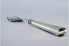 Fish serving fork in cut silver and embossed with acanthus leaves