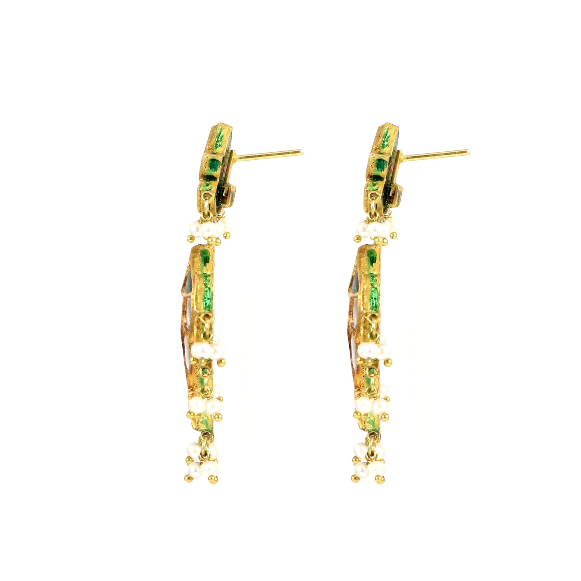 Introducing our exquisite fish-shaped earrings, crafted with the finest polki stones and adorned with green enamel. These captivating earrings are a perfect blend of elegance and uniqueness, designed to make a statement wherever you go. The fish