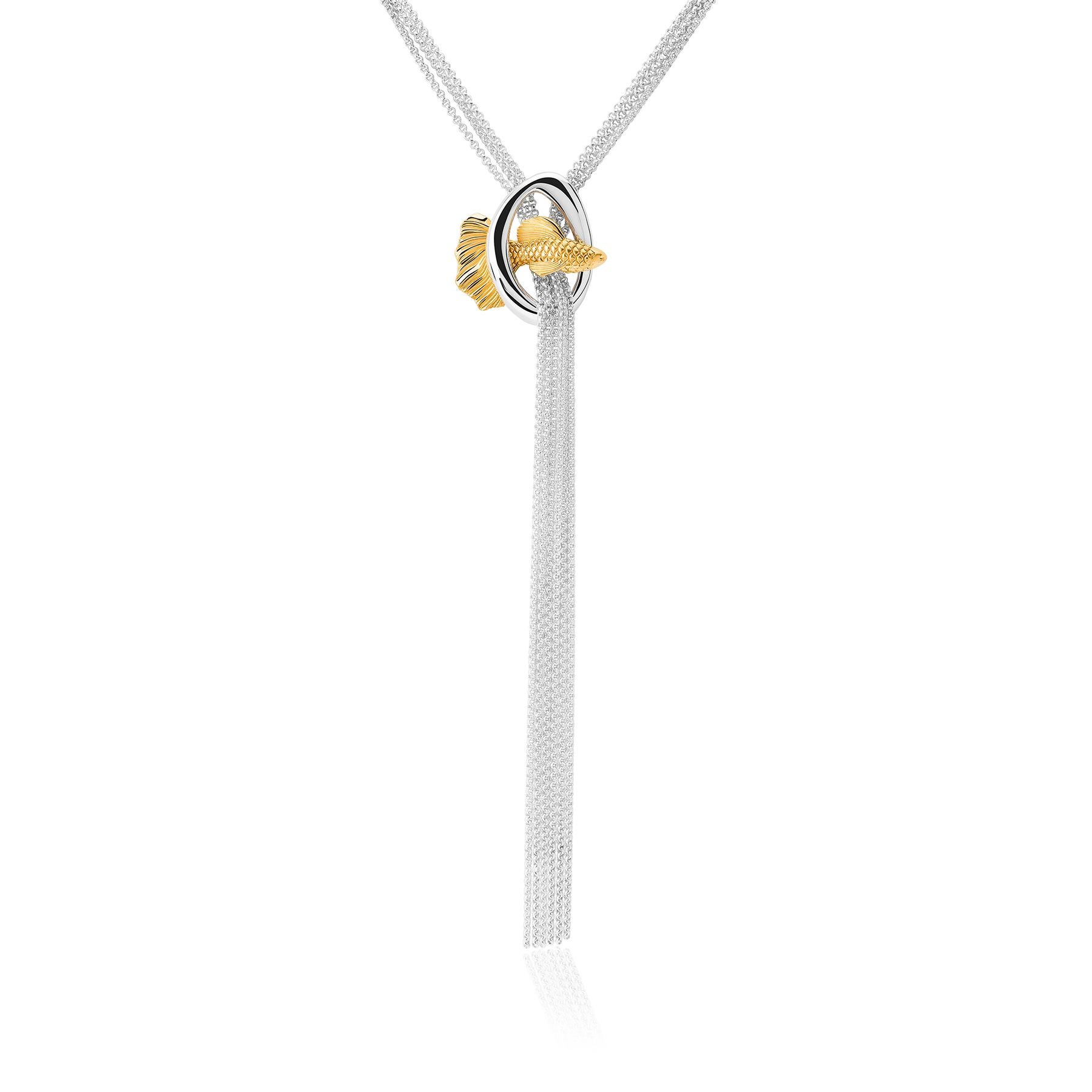 The Fish Necklace from the Animals Collection by TANE is made of sterling silver with 23 karat yellow gold vermeil. Suspended from a set of 23.6” chains, you will find an irregular link designed for the collection, inspired by nature. Through the