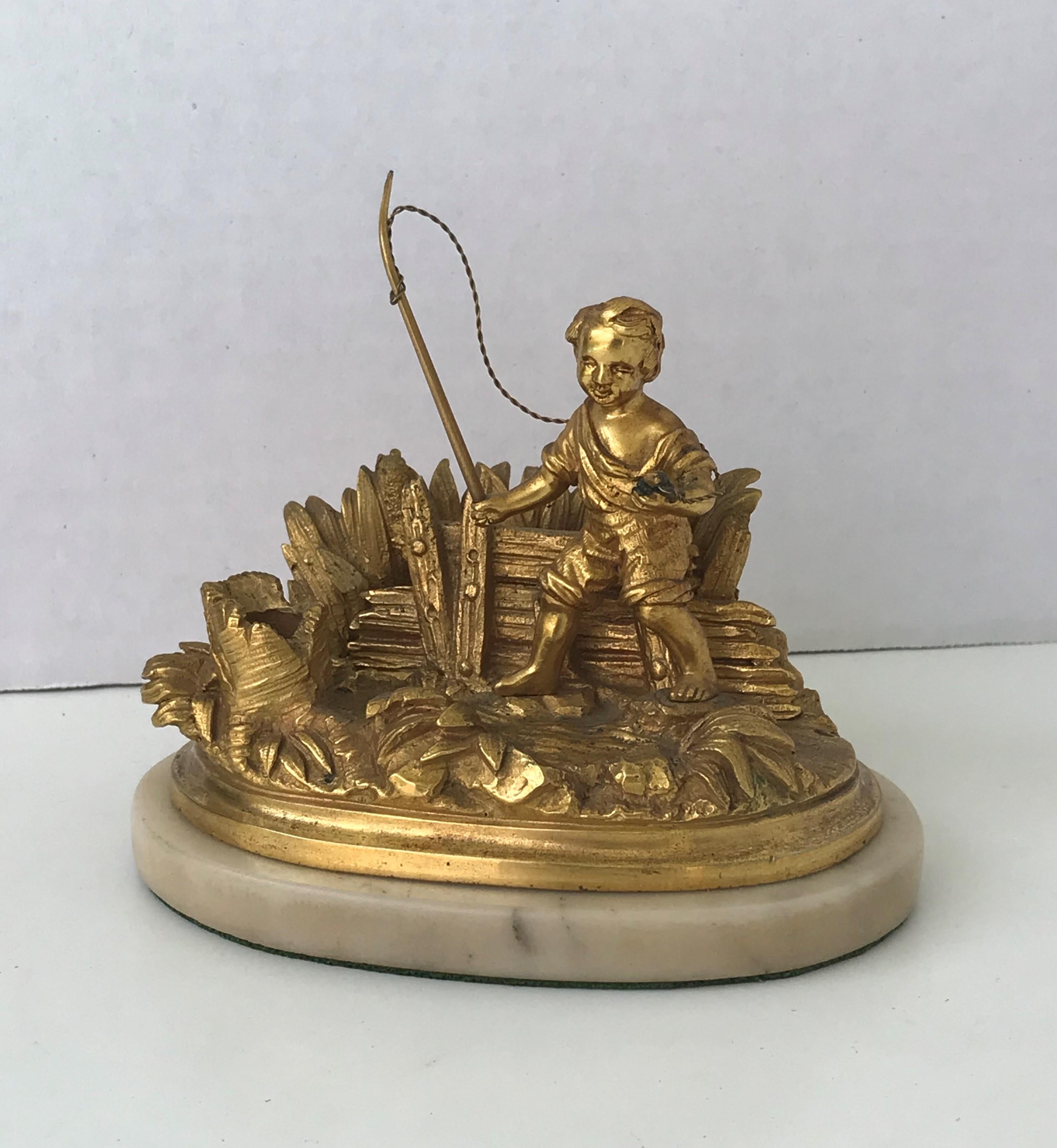 REDUCED FROM $450....This is a 19th century French bronze ink stand and pen holder/rest. Finely detailed figurative french bronze D'Ore desktop writing organizer featuring a fishing boy in a natural setting exhibiting marsh and riverside plants.