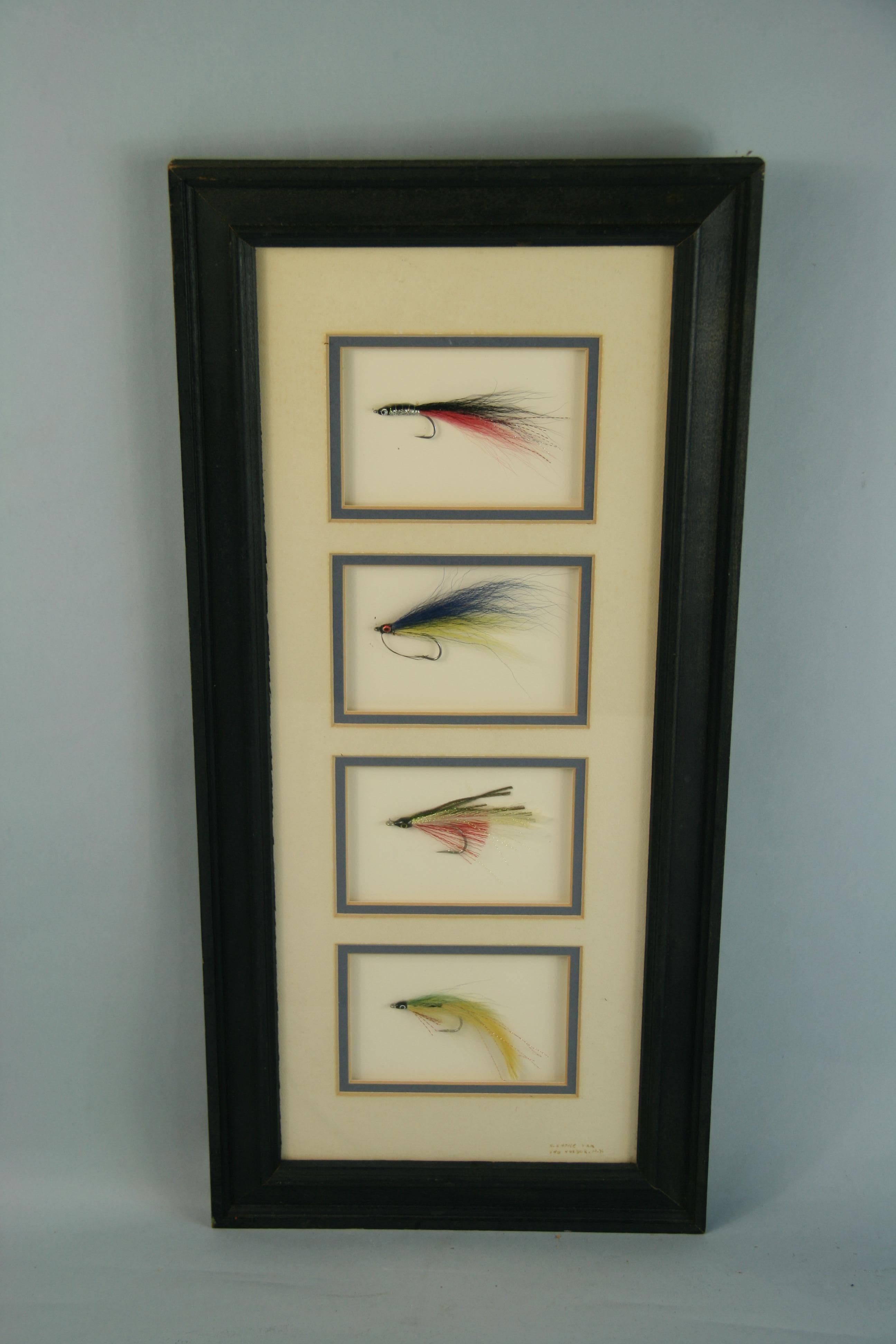 3-653 Fishing lures encased in a wood frame.