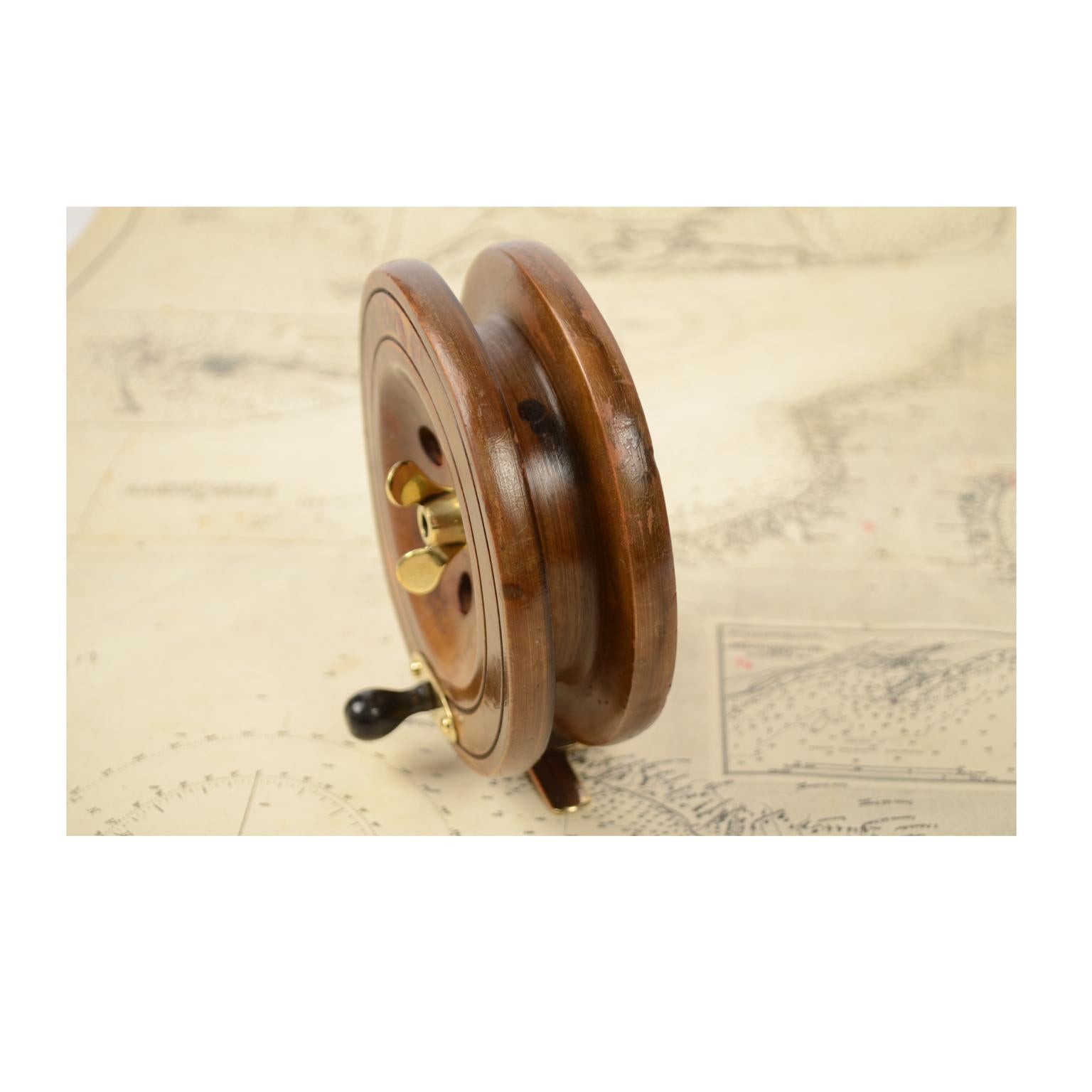 British Fishing Reel of Turned Oak and Brass, 1900
