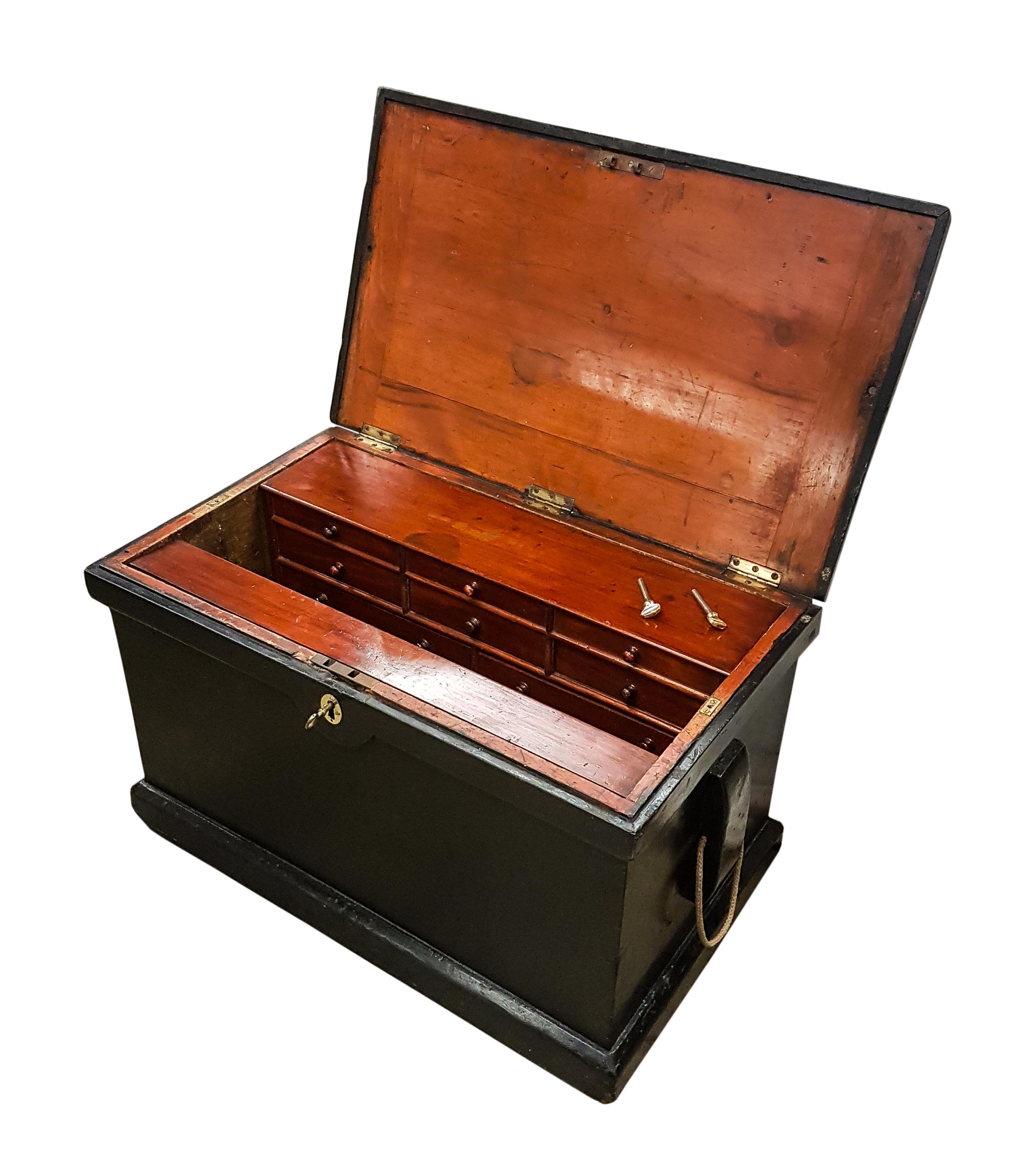 A charming old late 19th century ships carpenters chest with the original fitted interior comprising of two removable sections, one having just a hinged top with the other having a hinged top and 5 drawers. The chest is predominantly painted pine