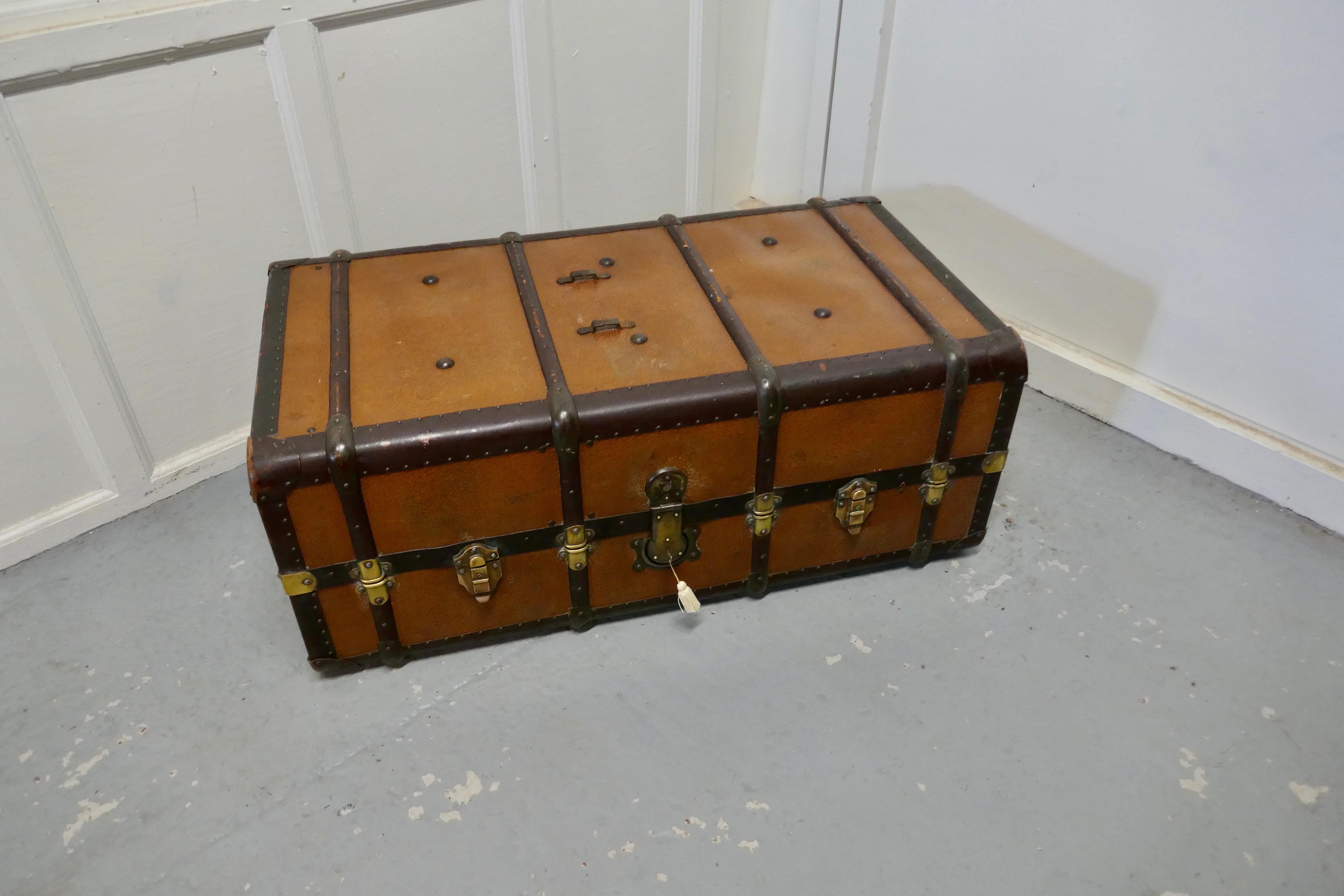 Fitted steamer trunk or cabin wardrobe,

A superb piece of history dating back to the time when your luggage would be taken to your cabin. This one is in canvas, bound with wood and with brass fittings
The trunk opens out, on one side there is a